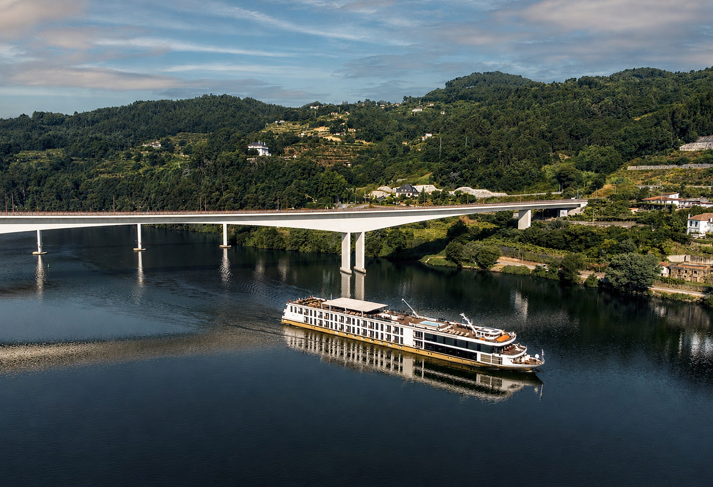 AmaVida passing under a Douro bridge