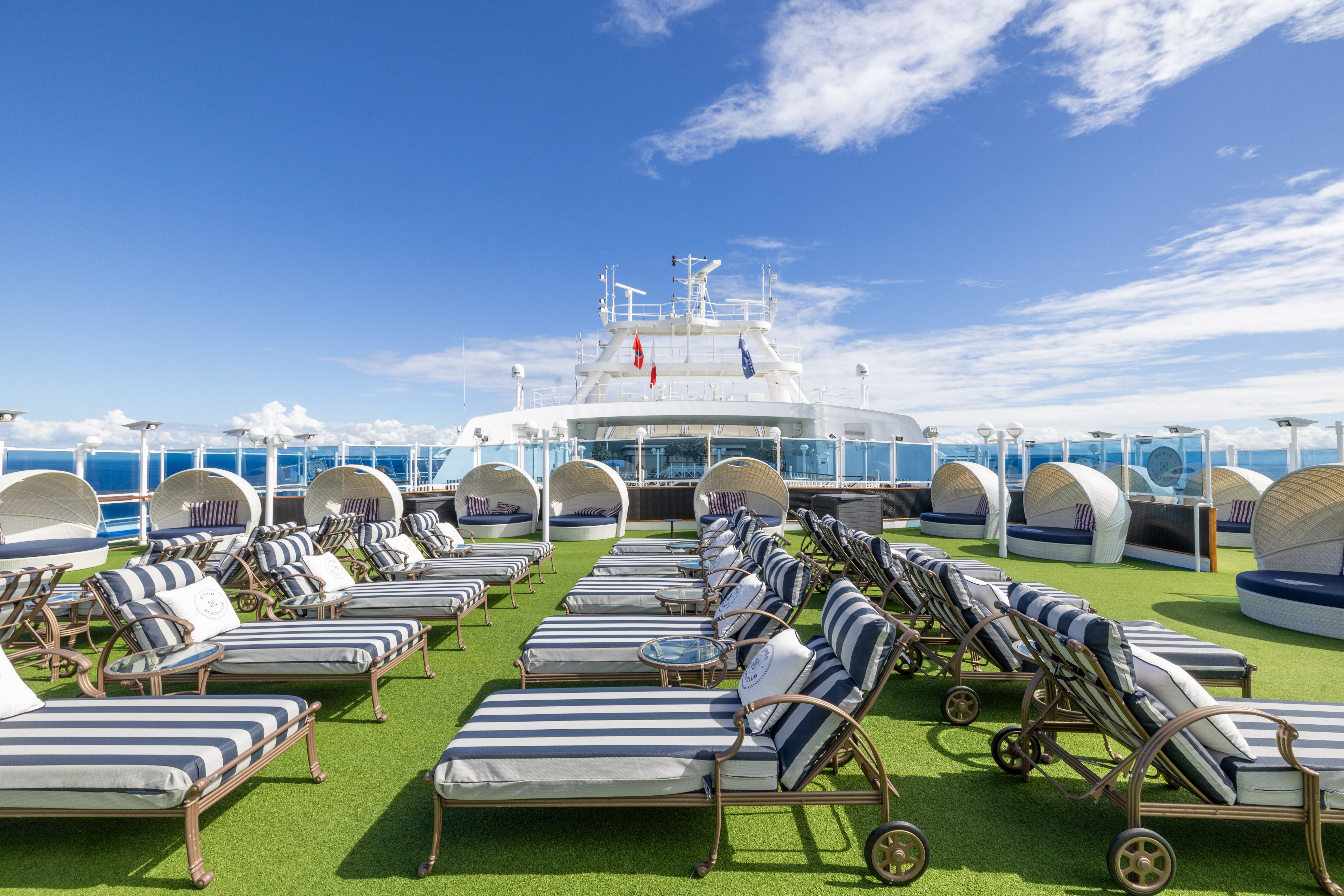 Carnival Adventure Byron Beach Club pool deck with loungers under bright sun