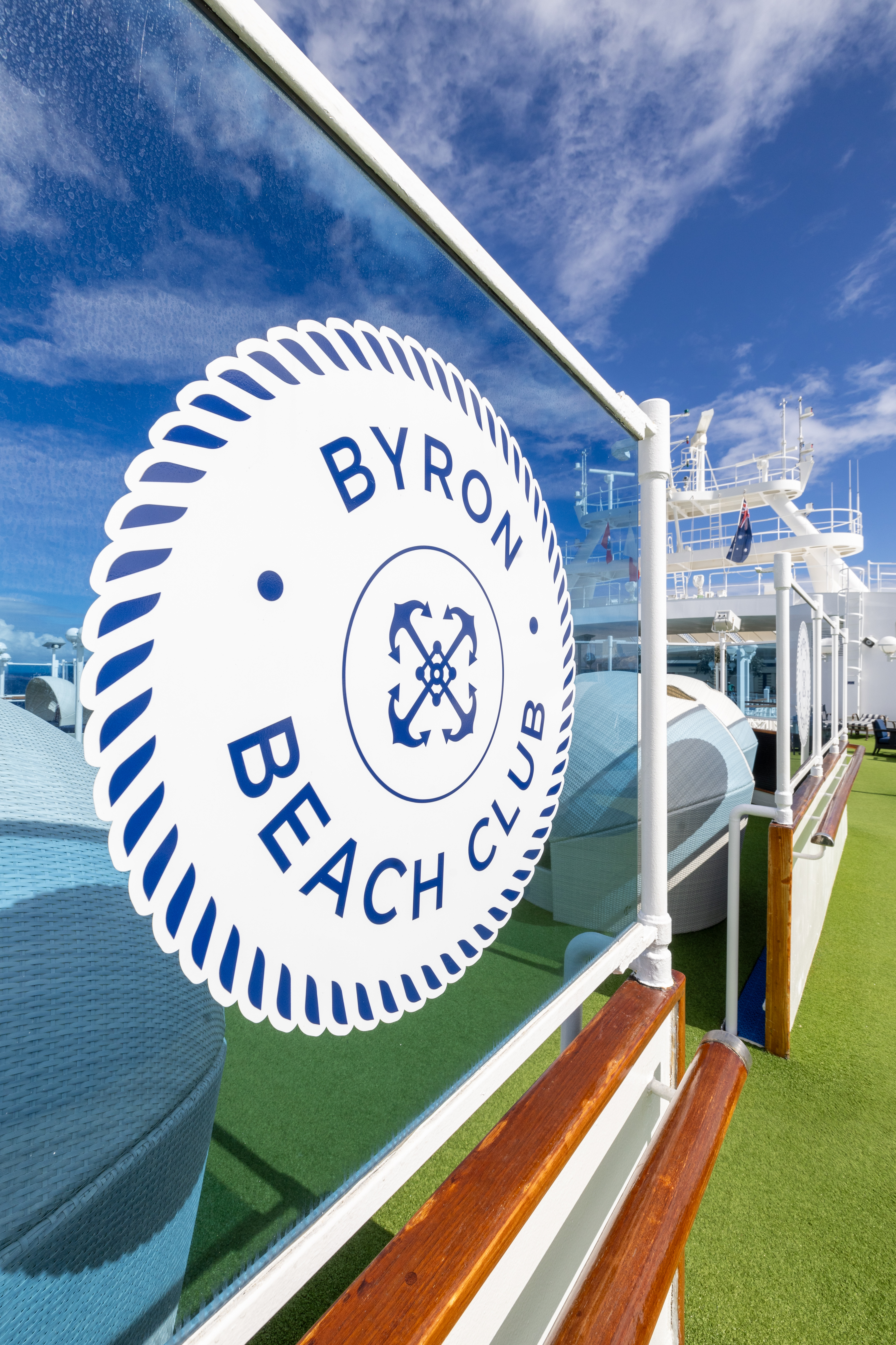 Carnival Adventure Byron Beach Club sign on sunny outdoor deck