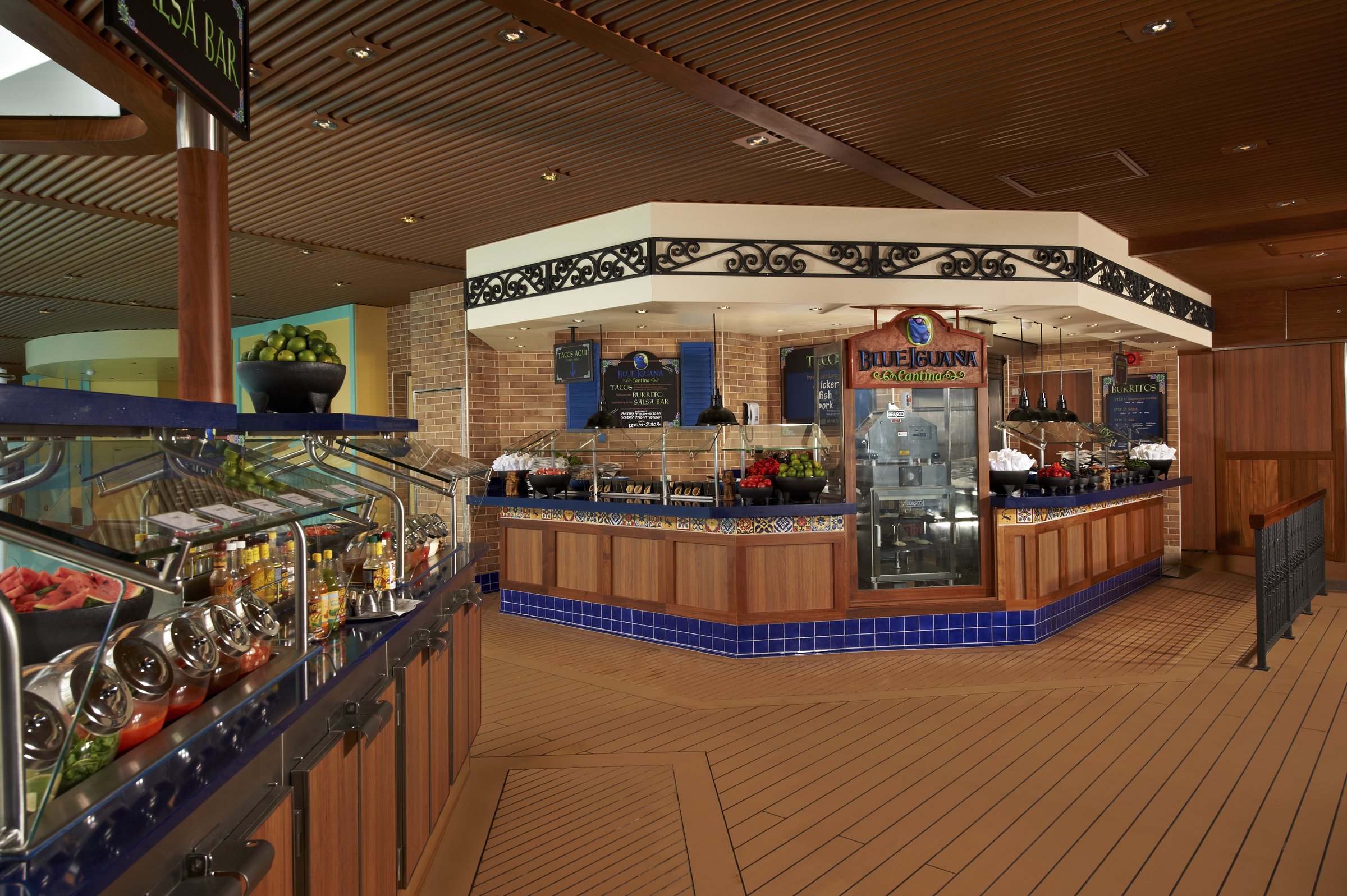 Carnival Breeze Blue Iguana Cantina counter with a tiled front and a salsa bar