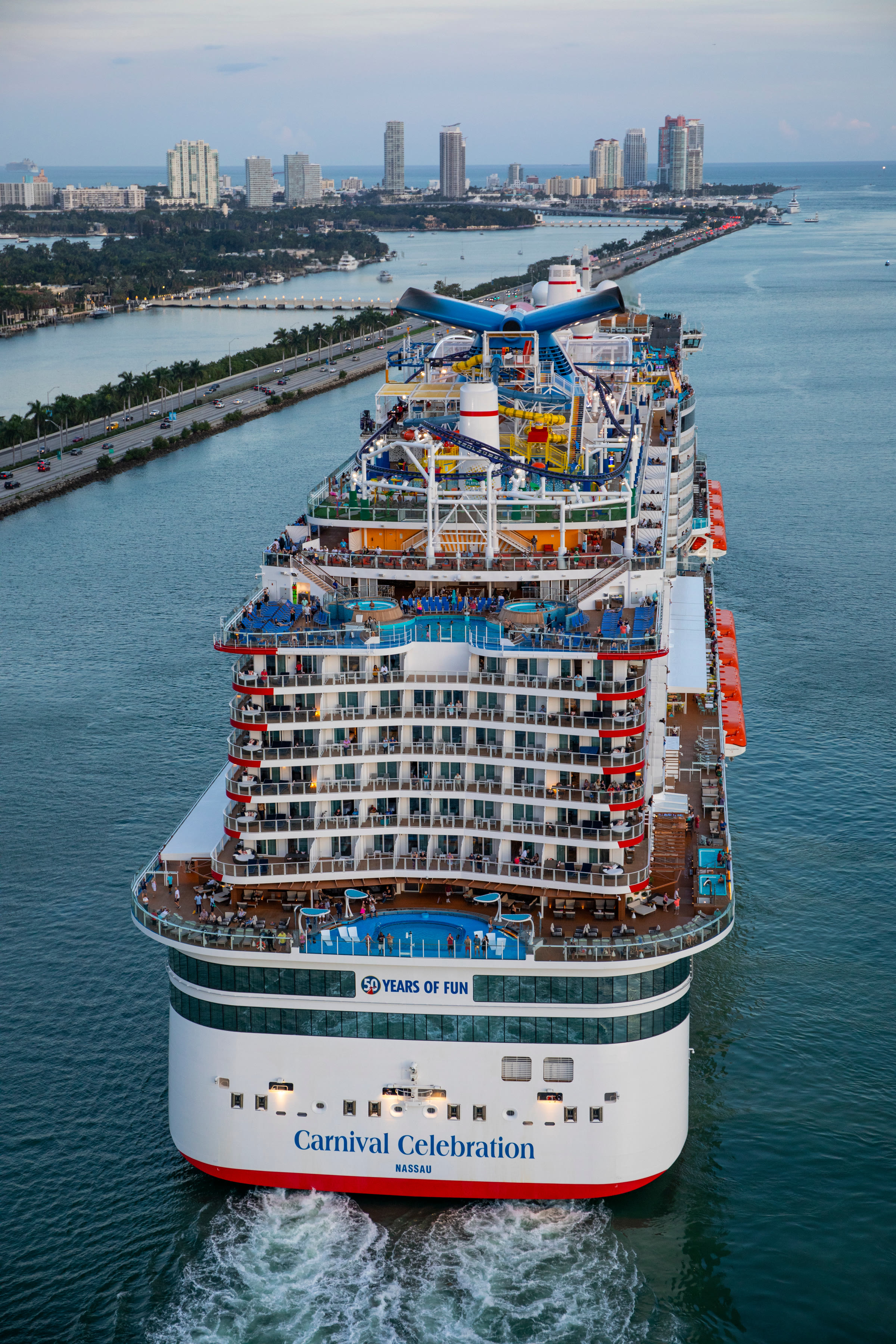 Carnival Celebration sunny aerial stern departing Miami channel