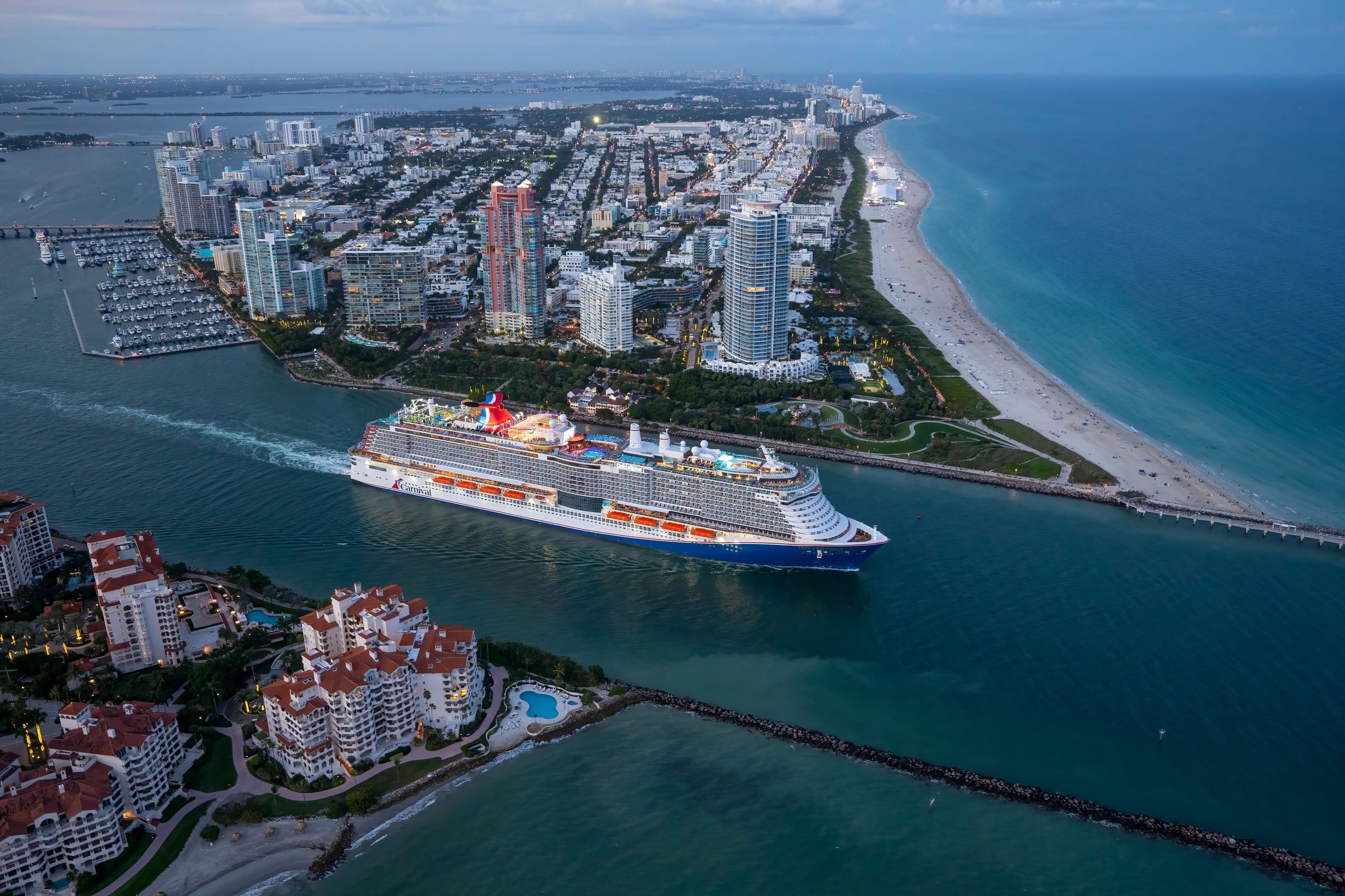 Aerial of Carnival Celebration sailing out of Government Cut past Miami Beach