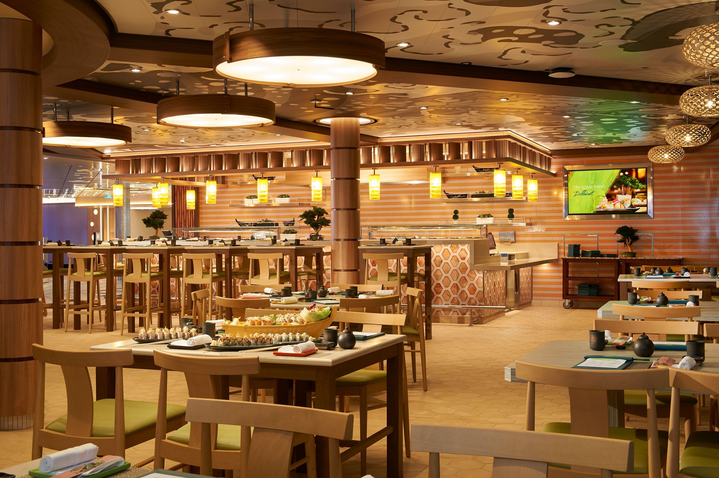 Carnival Celebration Bonsai Sushi with wooden tables and a sushi counter