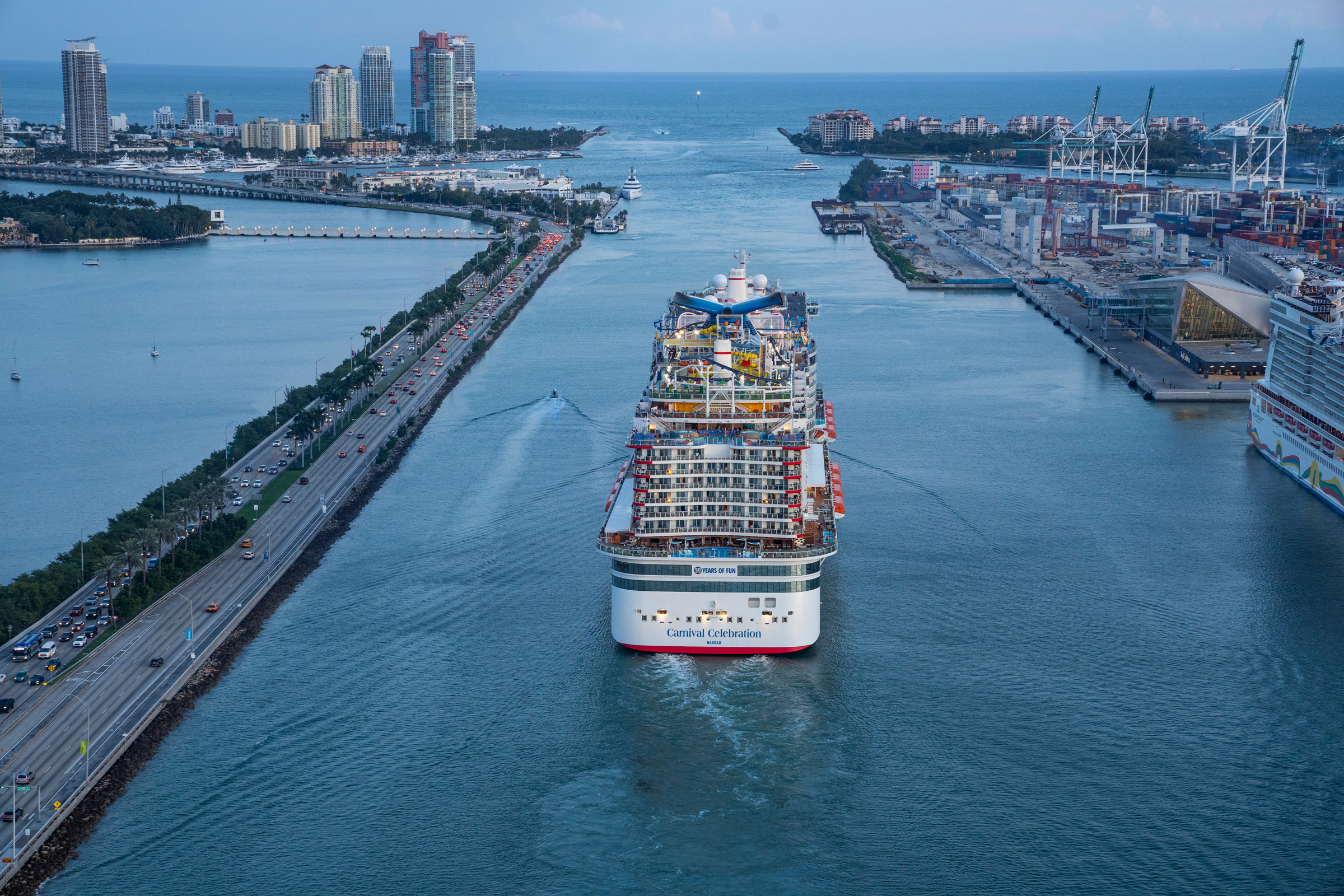 Carnival Celebration sunny aerial stern outbound in Miami channel