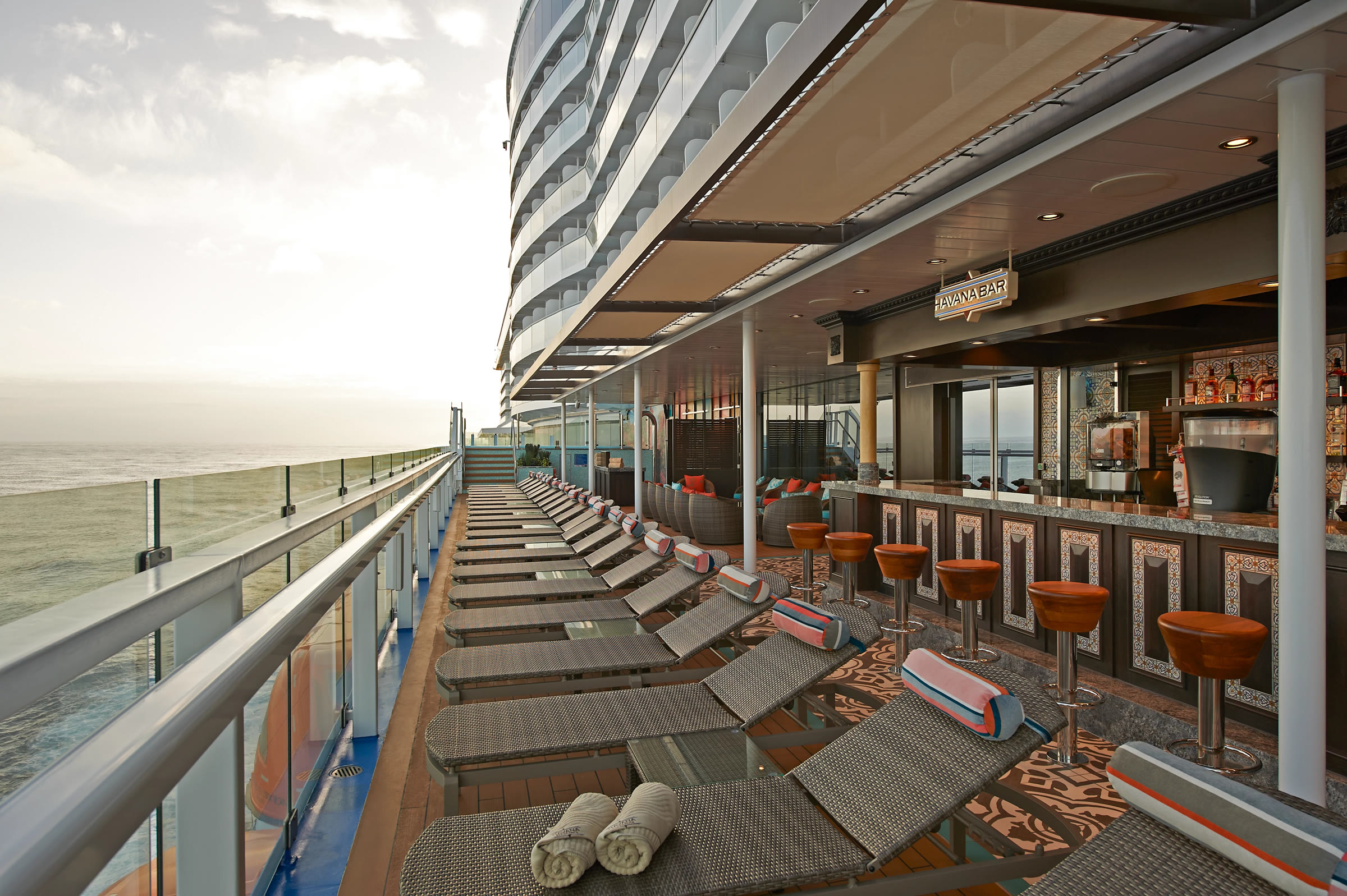 Sunny Havana Bar deck lounge overlooking the ocean aboard Carnival Celebration