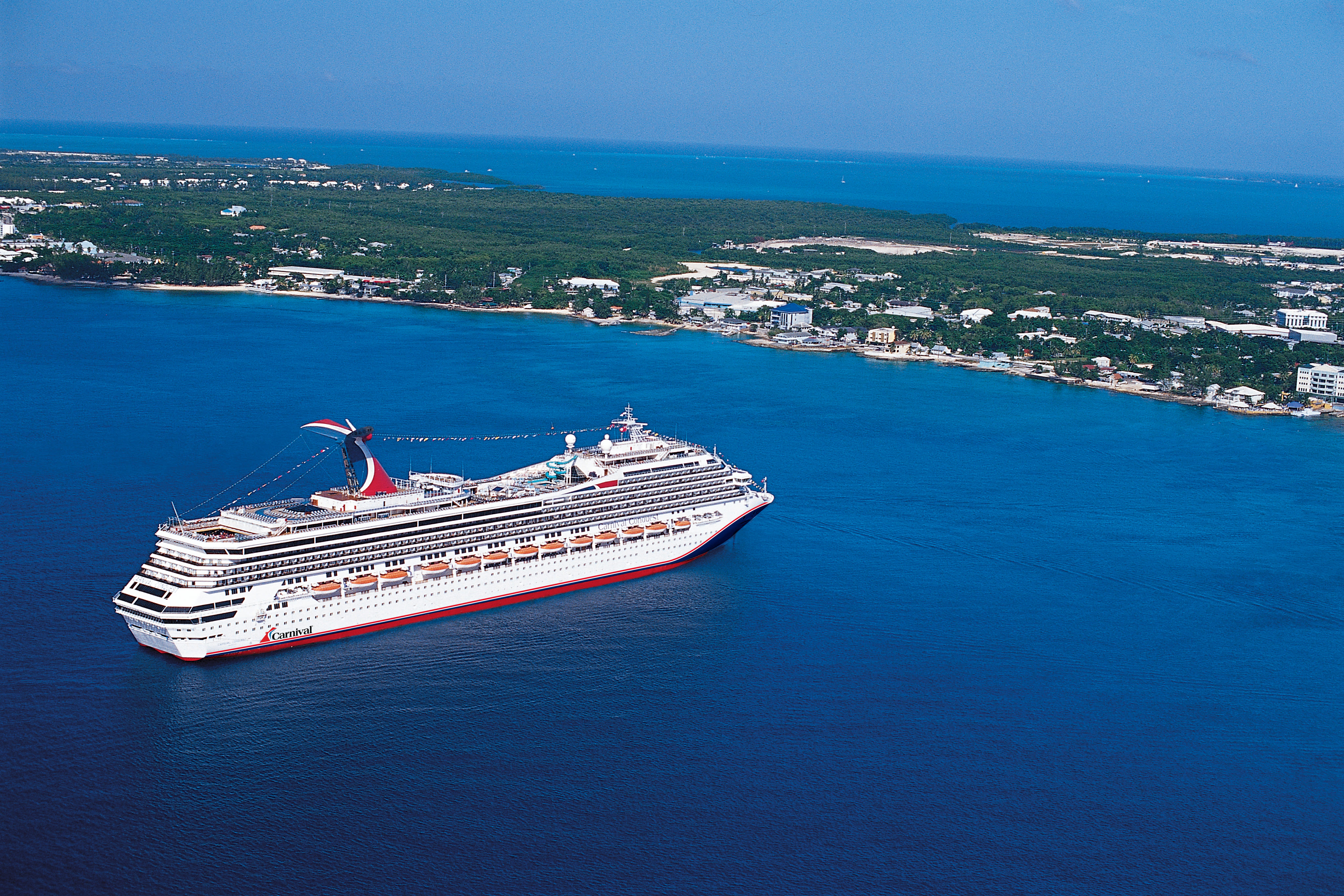 Carnival Conquest blue hull aerial at sea