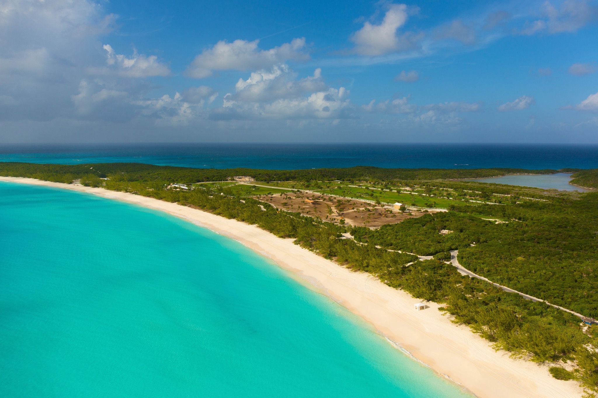 Half Moon Cay long white-sand beach and turquoise water, sunny aerial