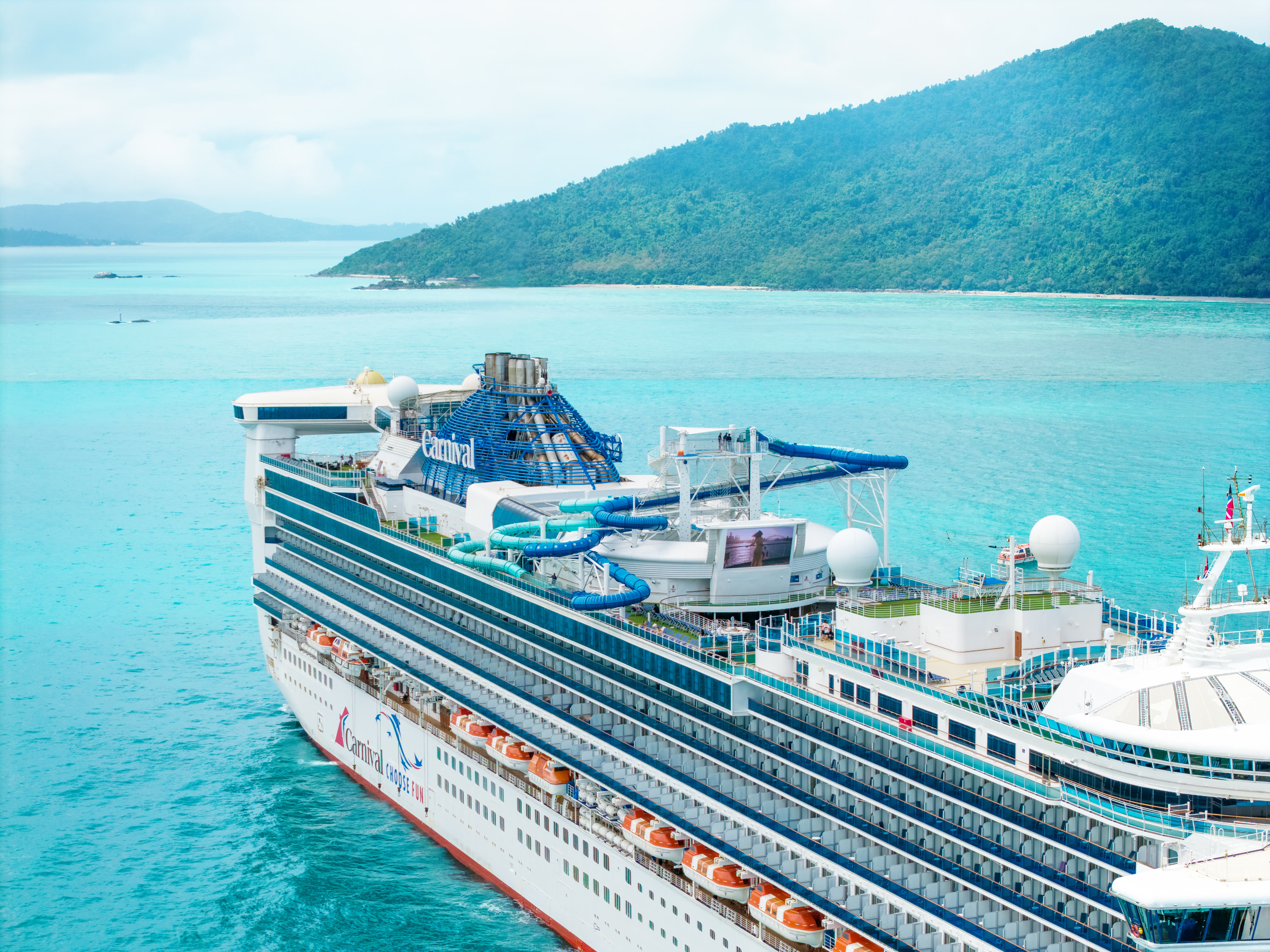 Carnival Encounter aerial at Airlie Beach, daytime white hull