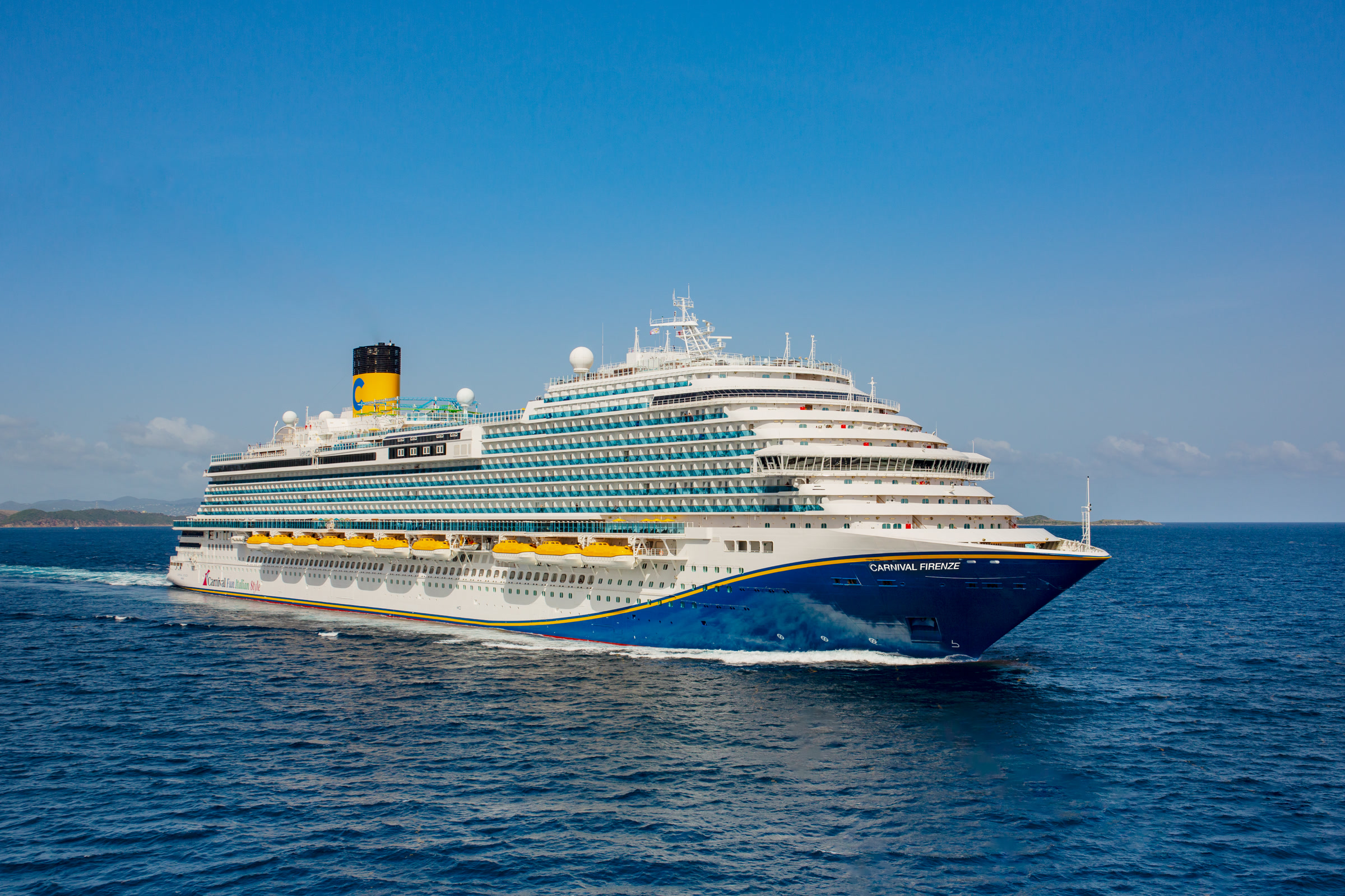 Carnival Firenze blue-hull aerial exterior in sunny open water