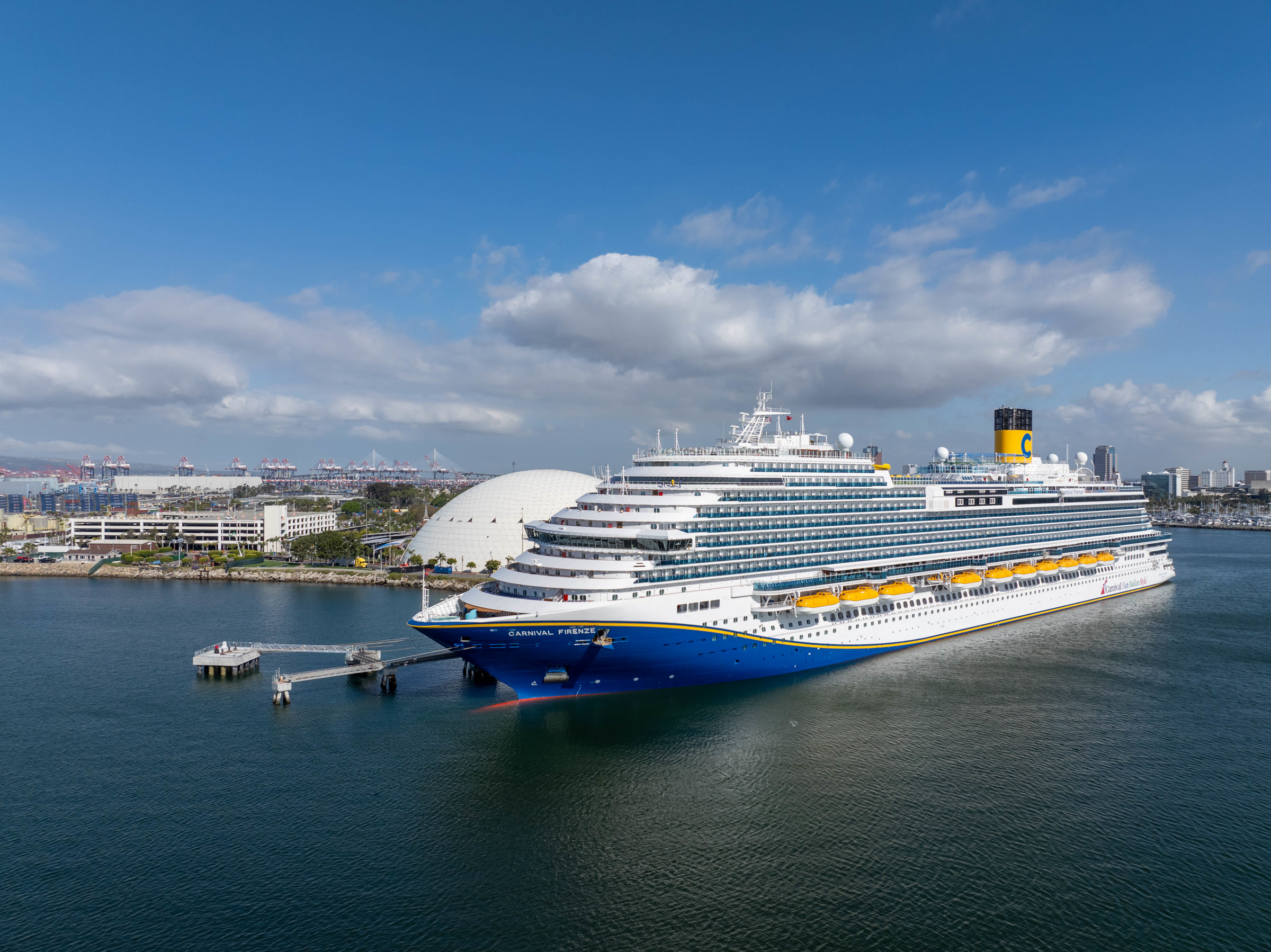 Carnival Firenze bow aerial arriving at Long Beach Cruise Terminal, sunny daylight