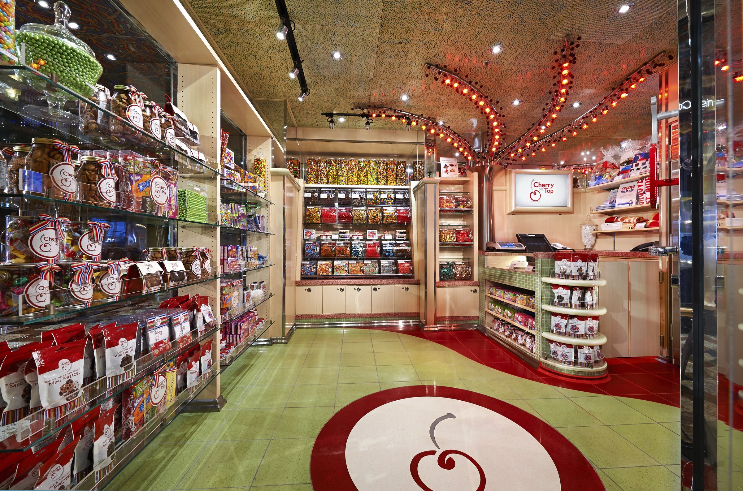 Carnival Freedom Cherry on Top sweets shop with candy-lined shelves and its cherry-swirl floor