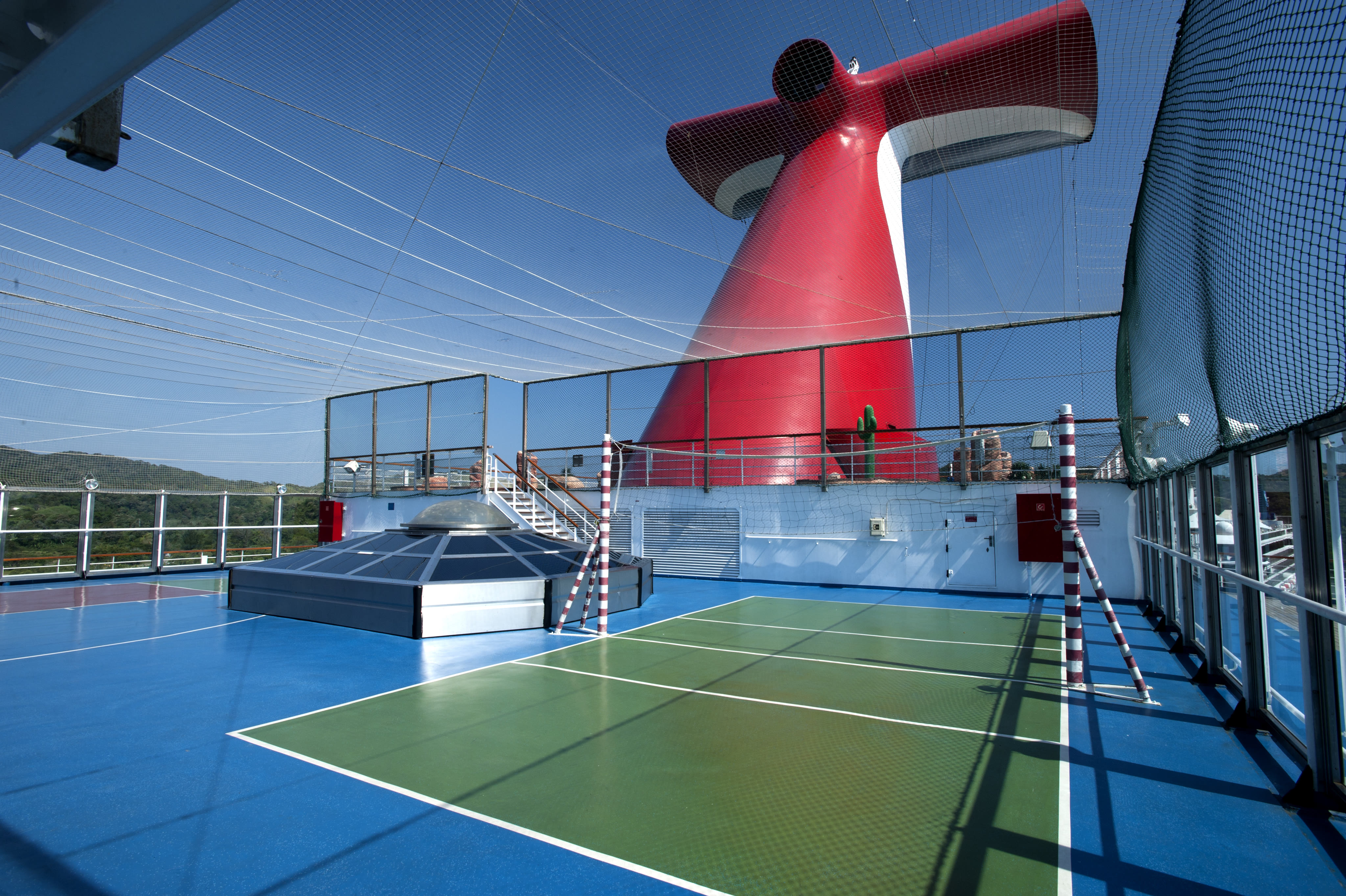 Carnival Glory sports deck court with funnel, sunny midday