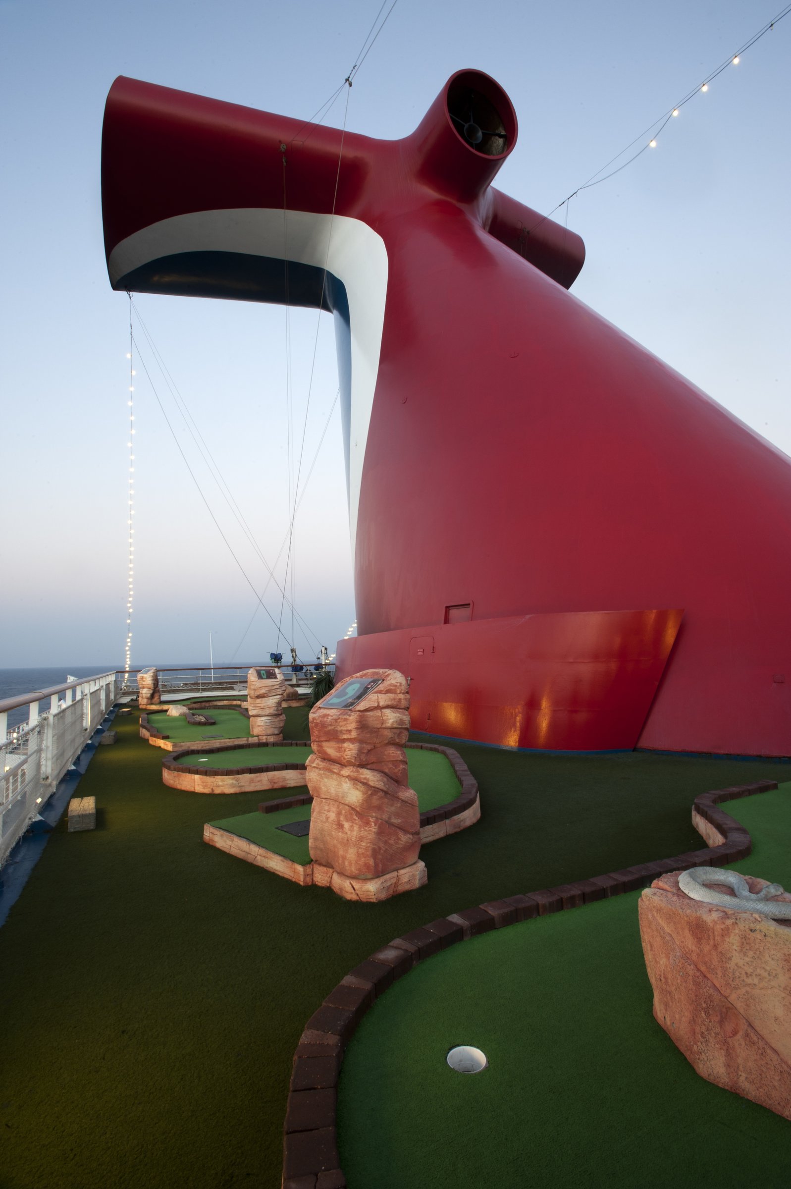 Carnival Glory mini golf course on the top deck beneath the red funnel