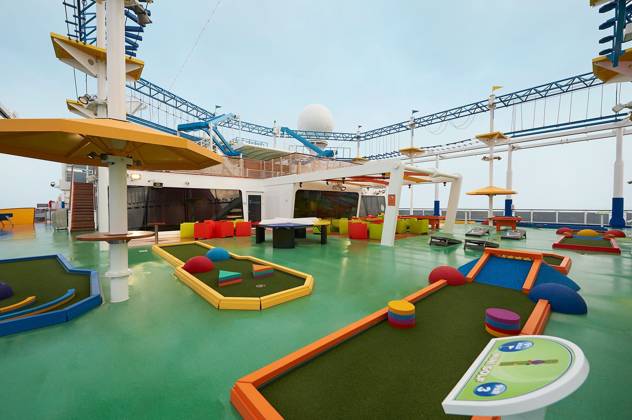 Carnival Horizon SportSquare mini golf course with the SkyRide and ropes course overhead