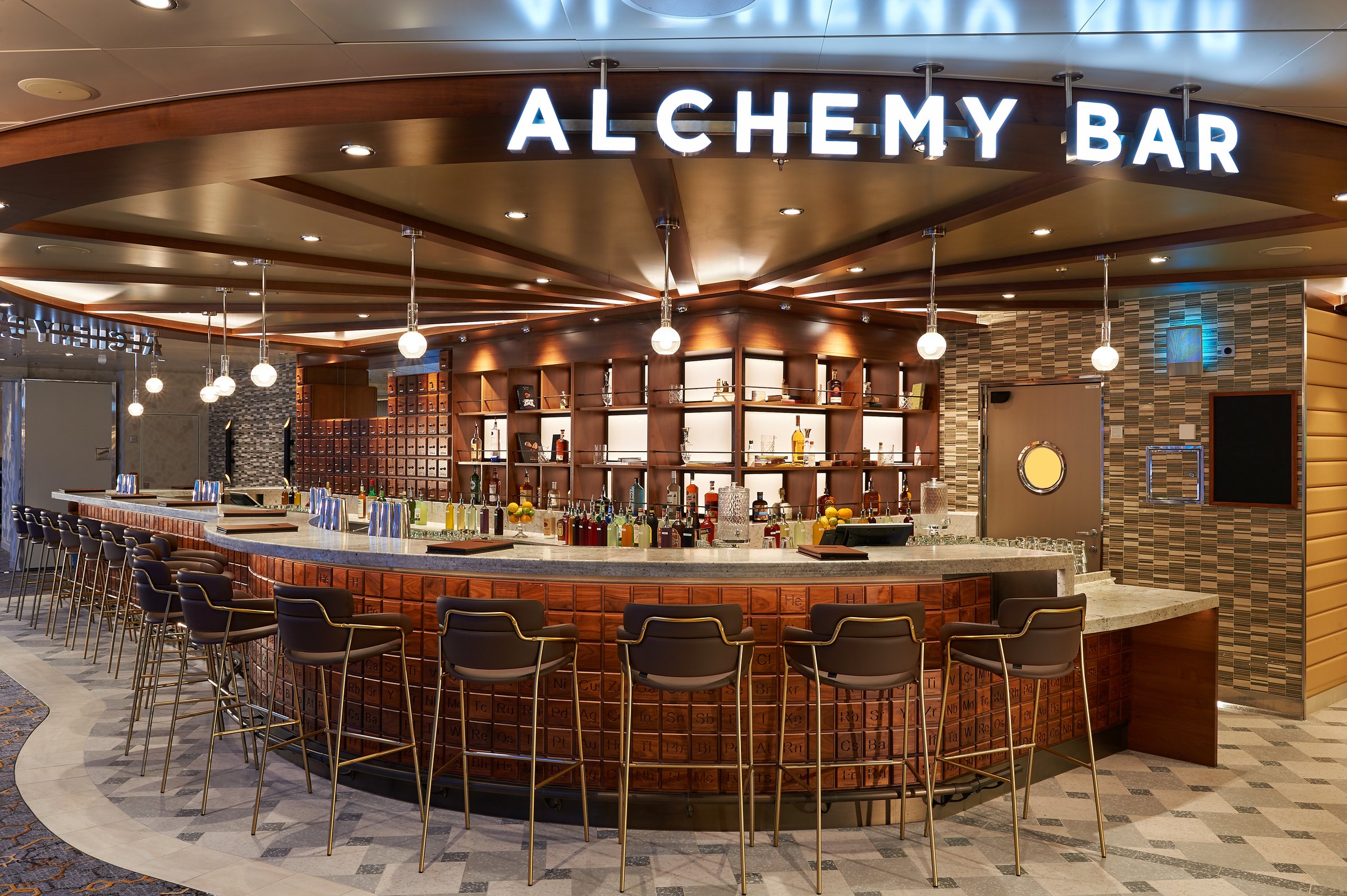 Carnival Jubilee Alchemy Bar with a curved counter and bar stools