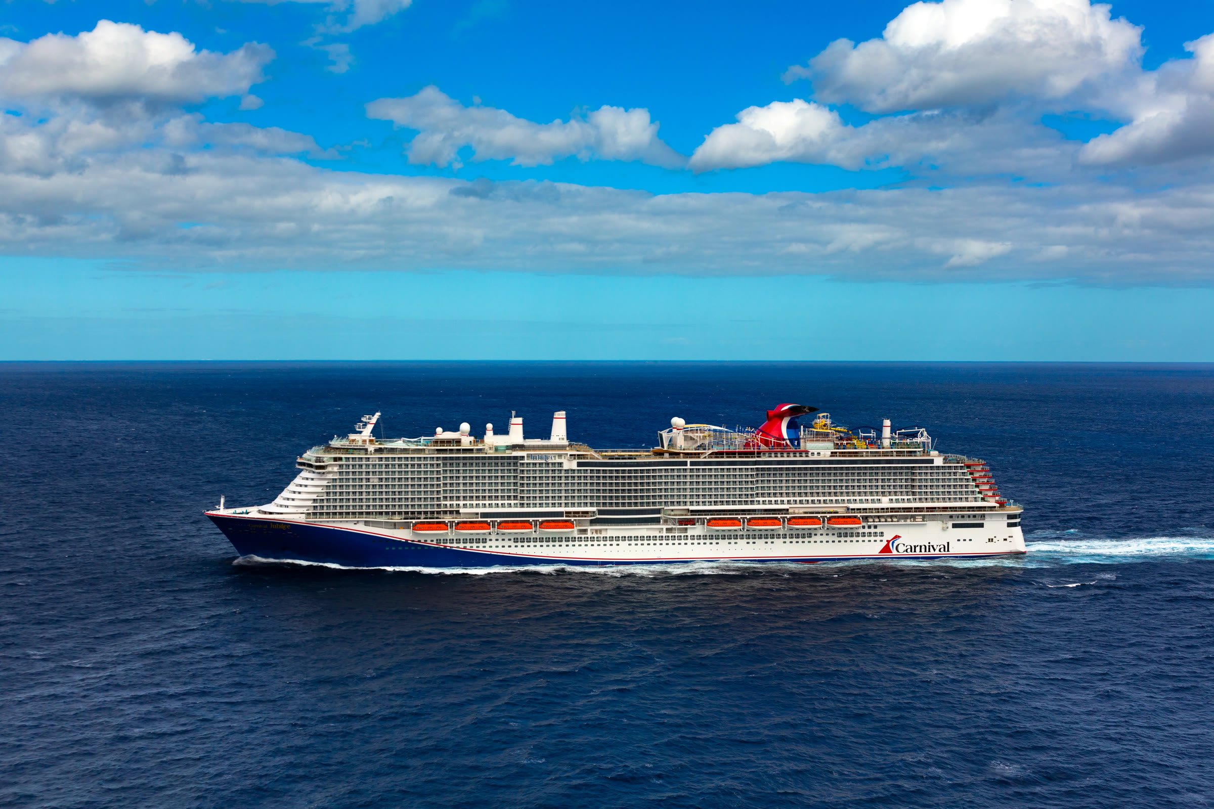 Carnival Jubilee sunny open-water aerial exterior
