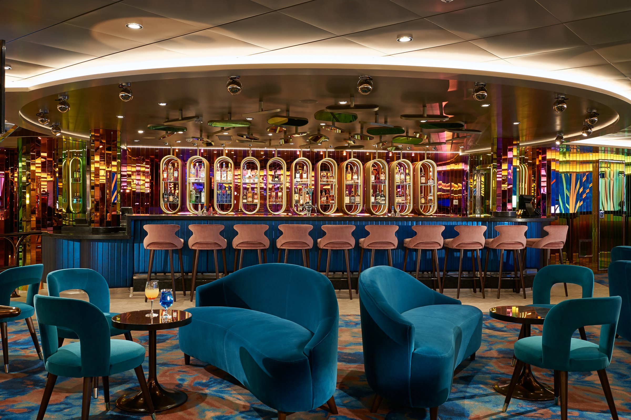Carnival Jubilee Center Stage Bar with teal velvet seating and a lit back bar