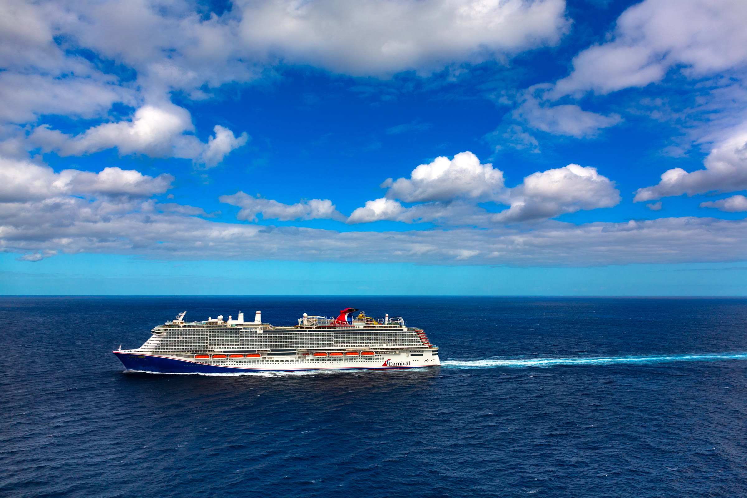 Carnival Jubilee sunny open-ocean aerial profile exterior