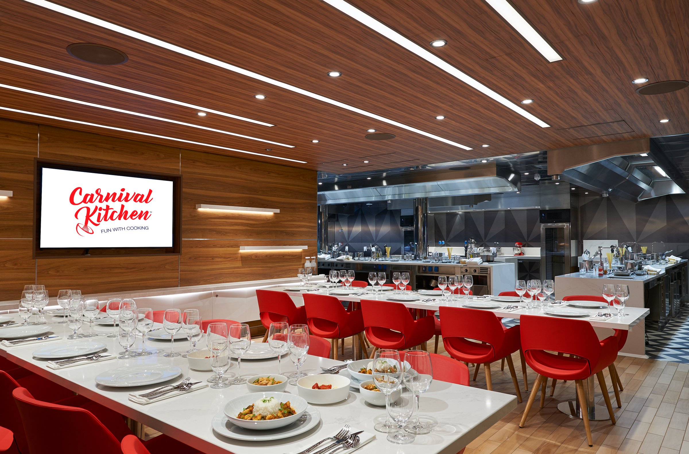 Carnival Jubilee Carnival Kitchen cooking-class dining room with red chairs and set tables