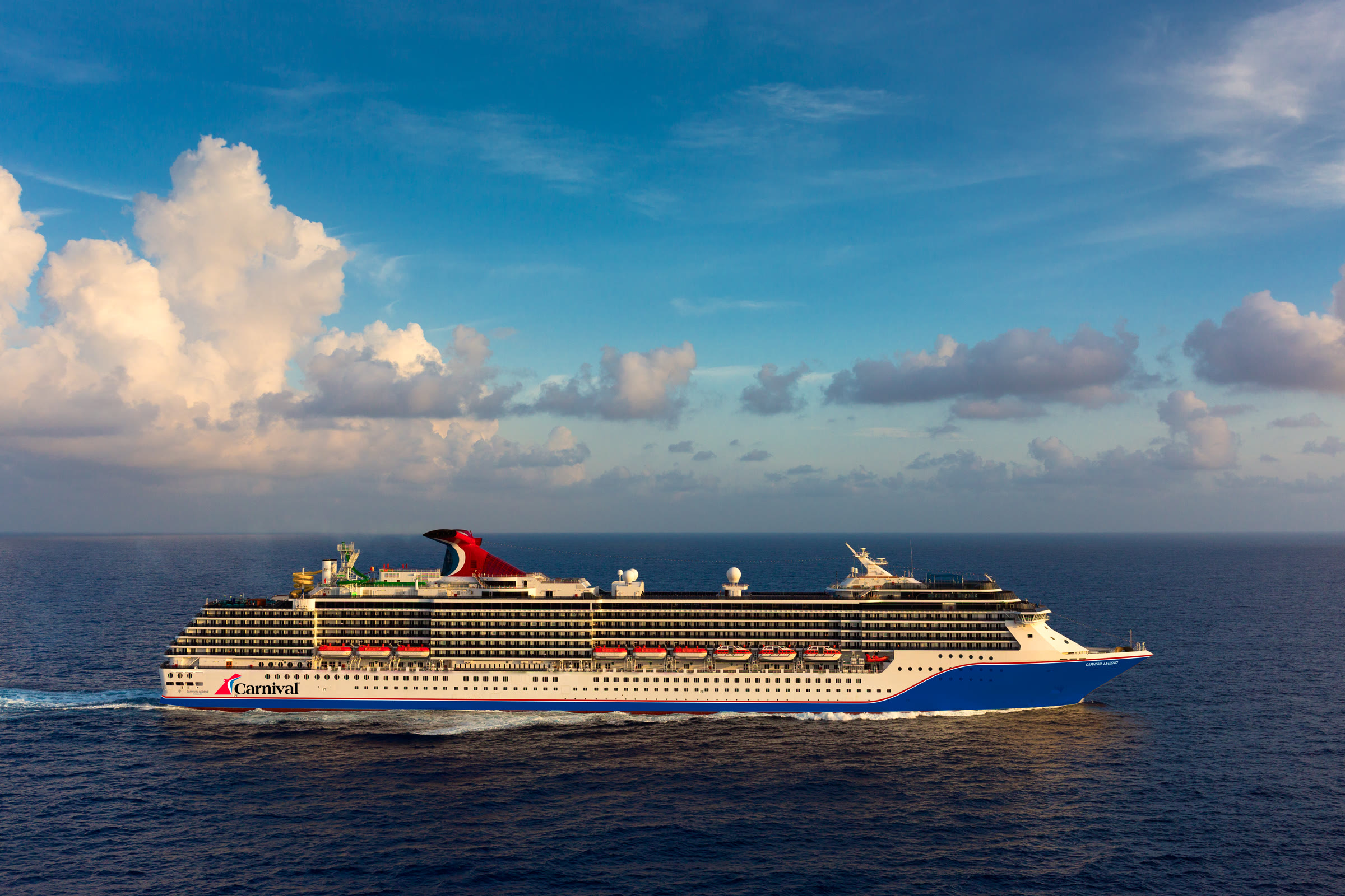 Carnival Legend blue-hull exterior in sunny open water