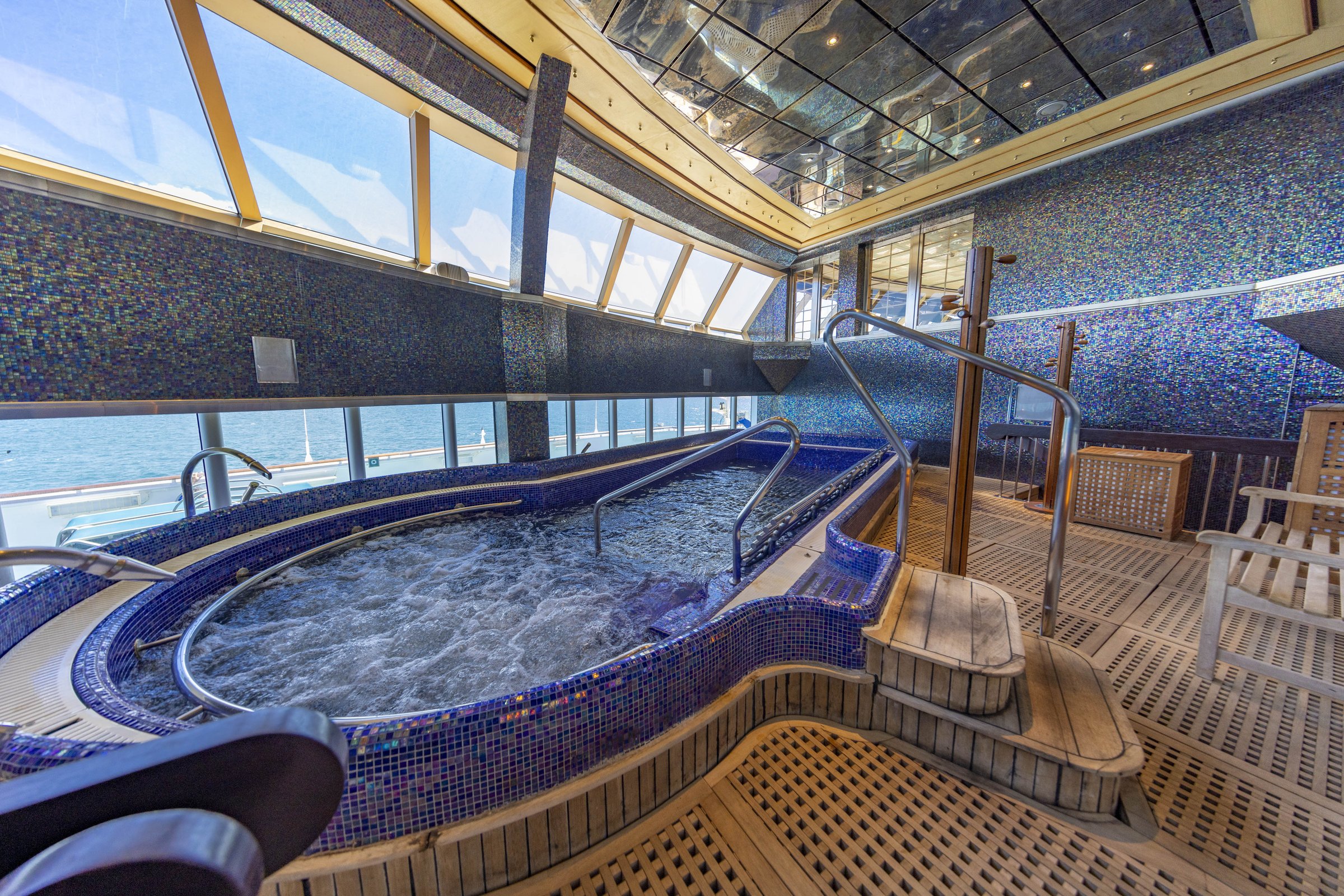 Carnival Luminosa Cloud 9 Spa thalassotherapy pool with ocean windows and teak decking
