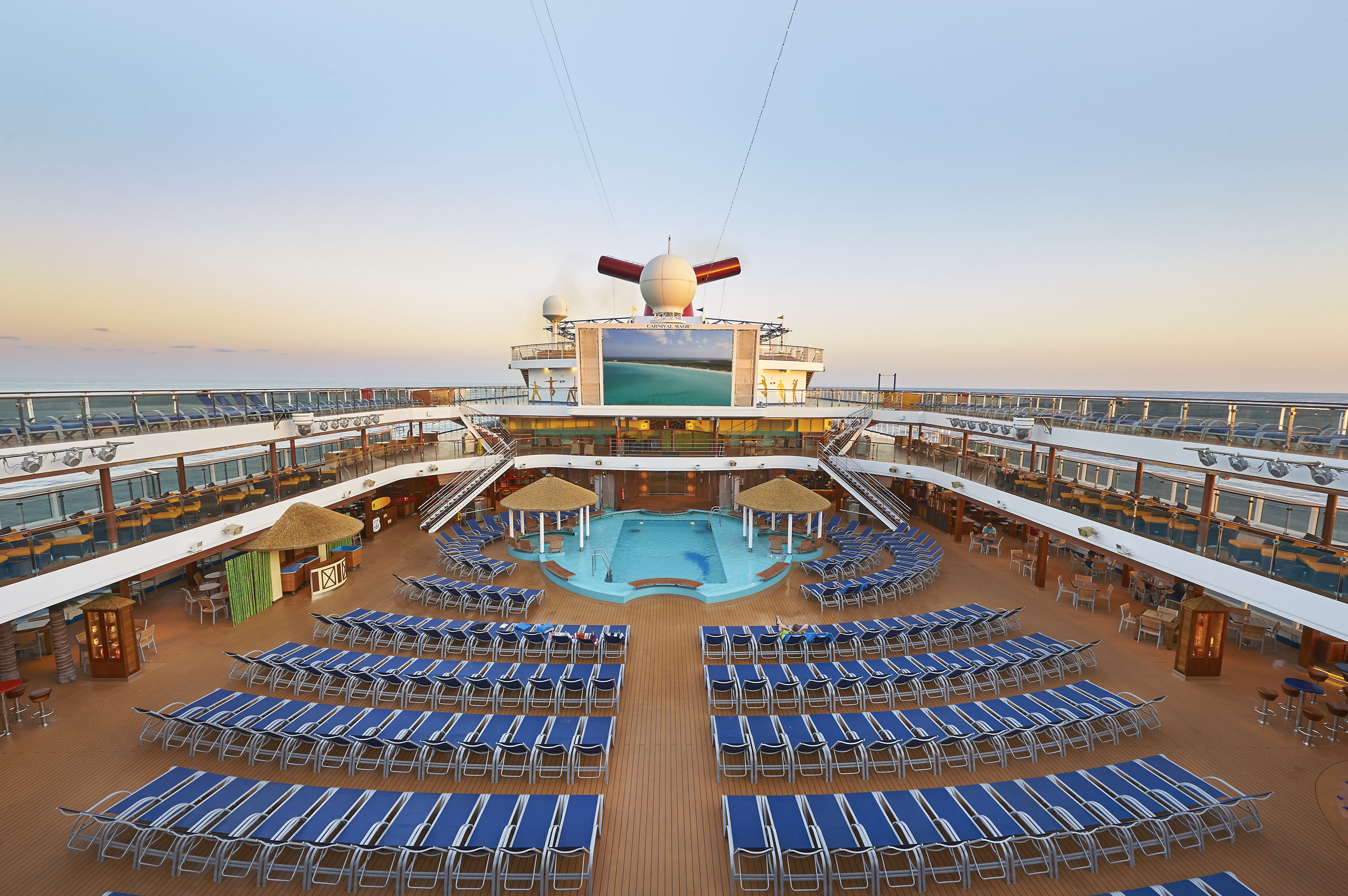 Carnival Magic midship pool and Seaside Theater in bright daylight