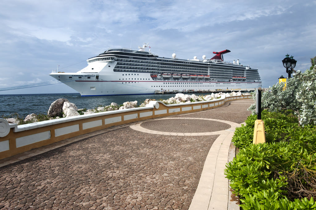 Carnival Miracle docked at a sunny tropical Curacao waterfront