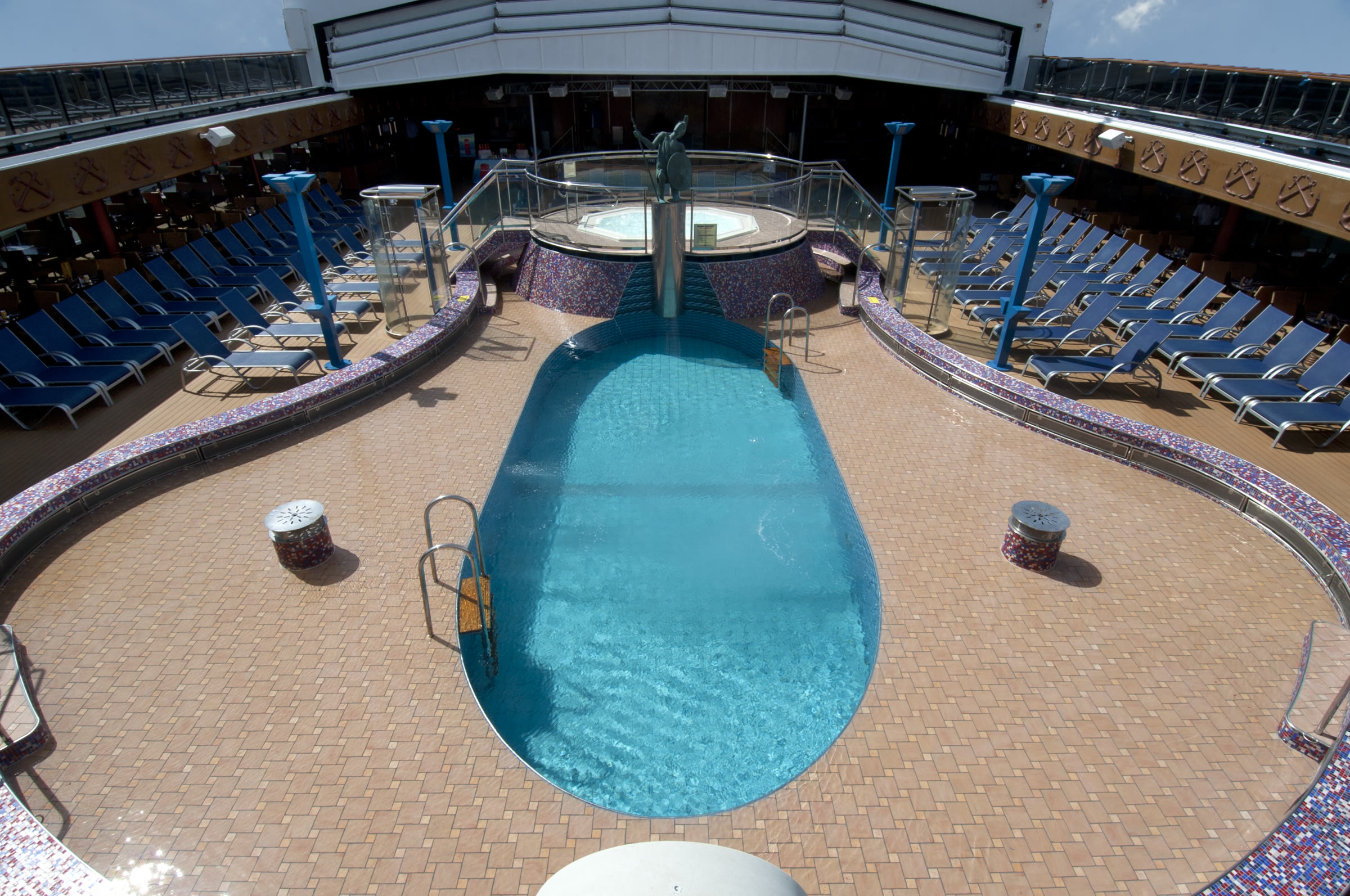 Carnival Miracle Ulysses Pool on a bright sunny upper deck