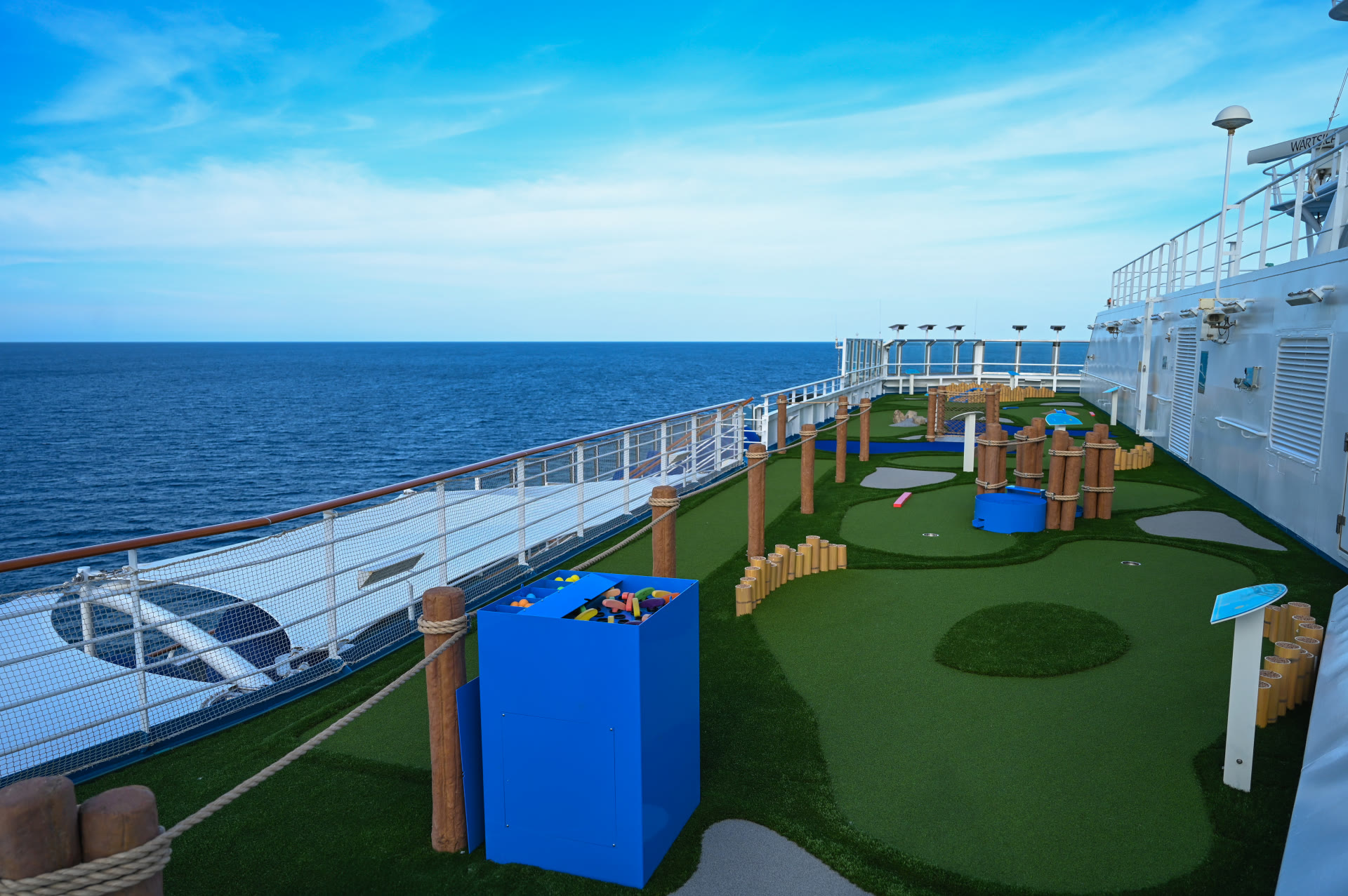 Carnival Splendor top-deck mini golf course in bright midday sun