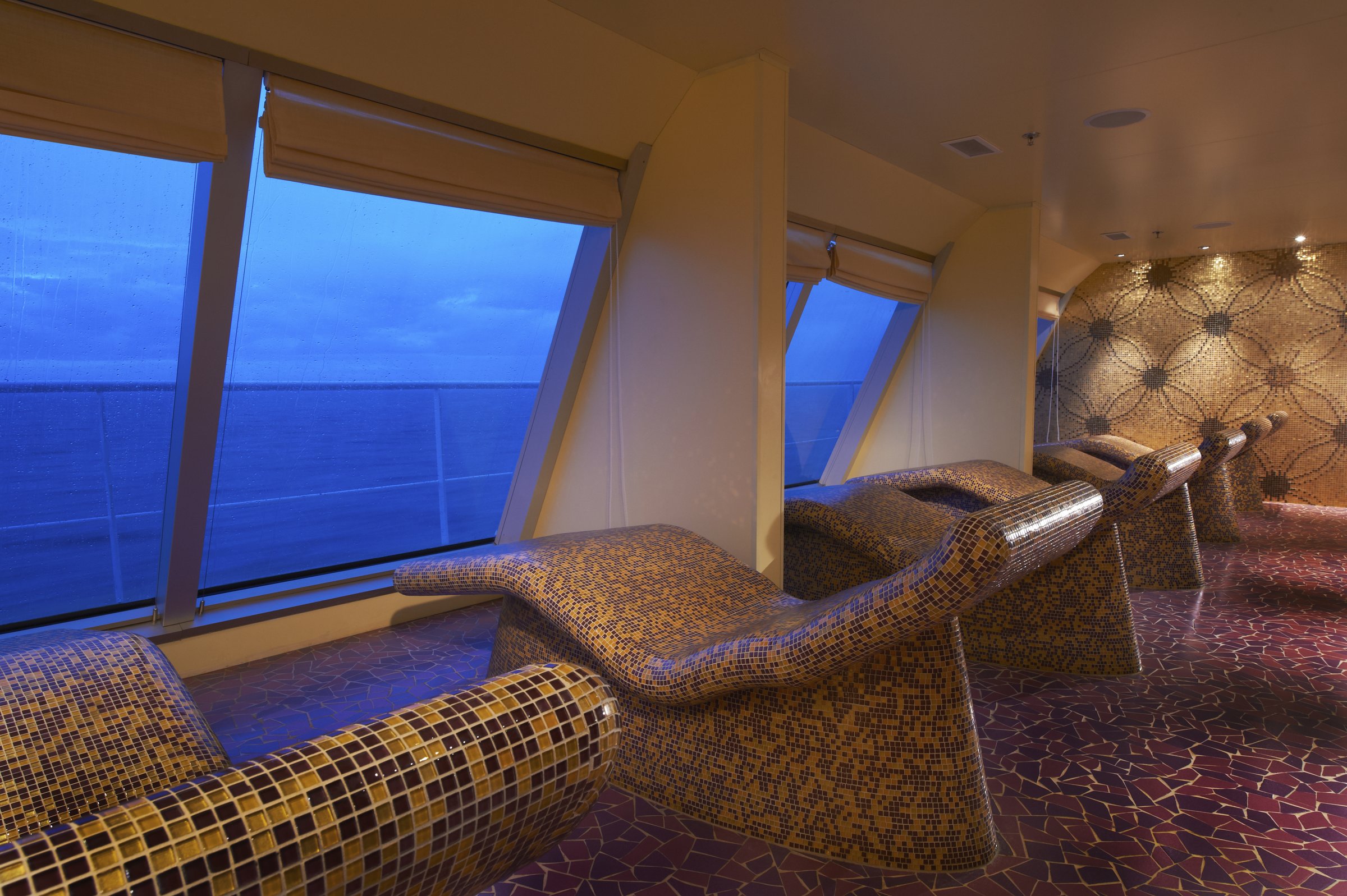 Carnival Sunshine Cloud 9 Spa thermal suite with mosaic heated loungers facing ocean windows