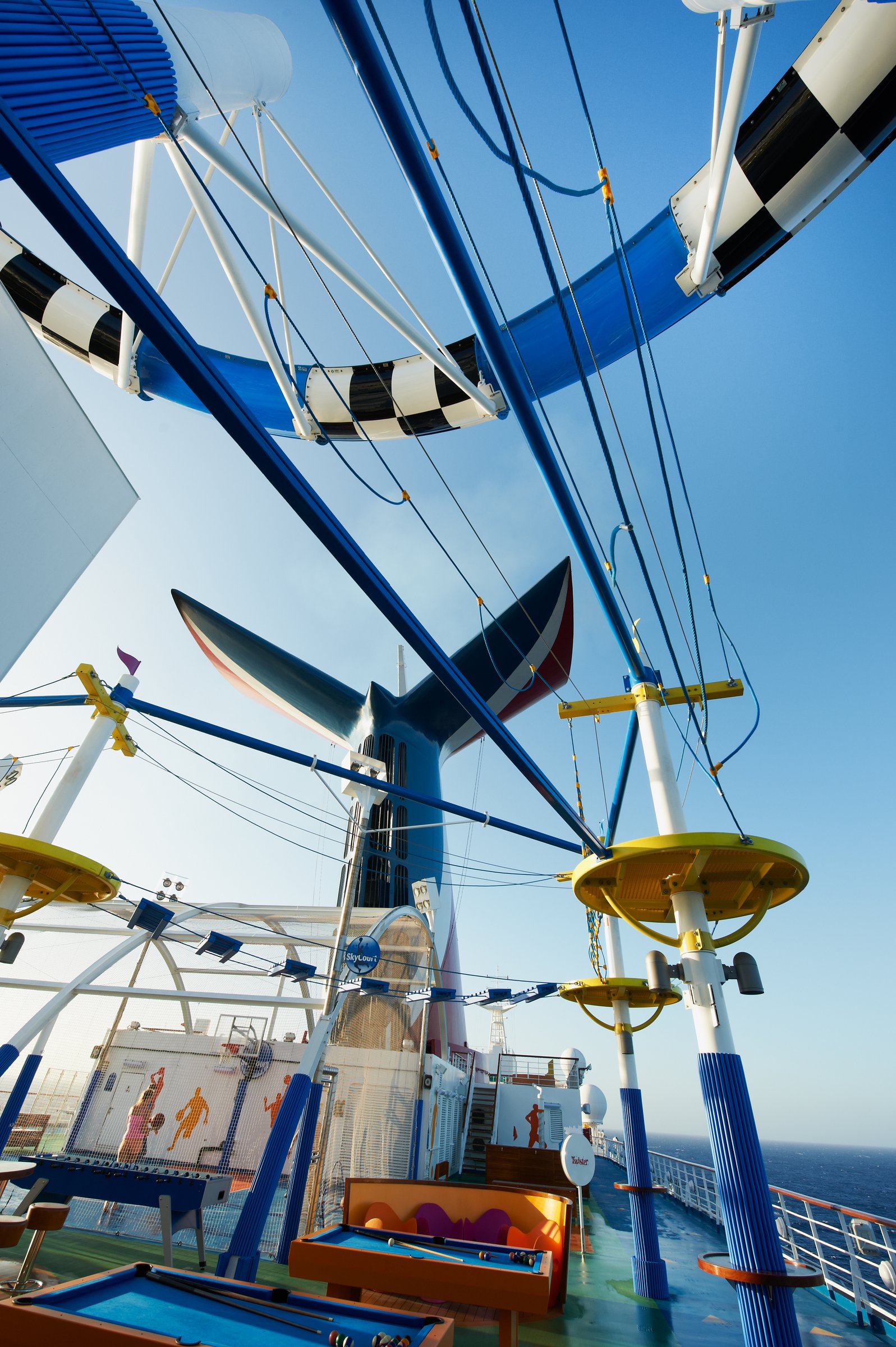Carnival Sunshine sports deck and WaterWorks slide framework looking up under a blue sky