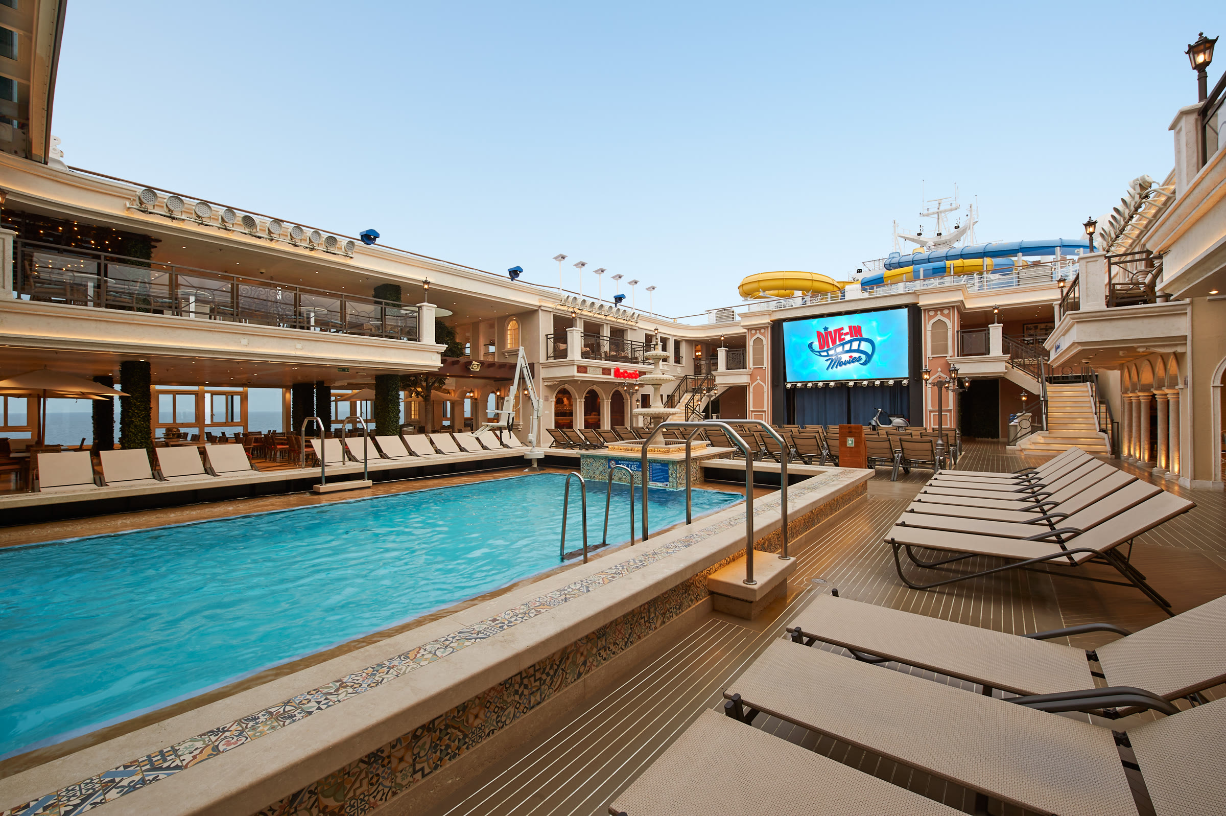 Sunny main pool and Dive-In Movies screen aboard Carnival Venezia