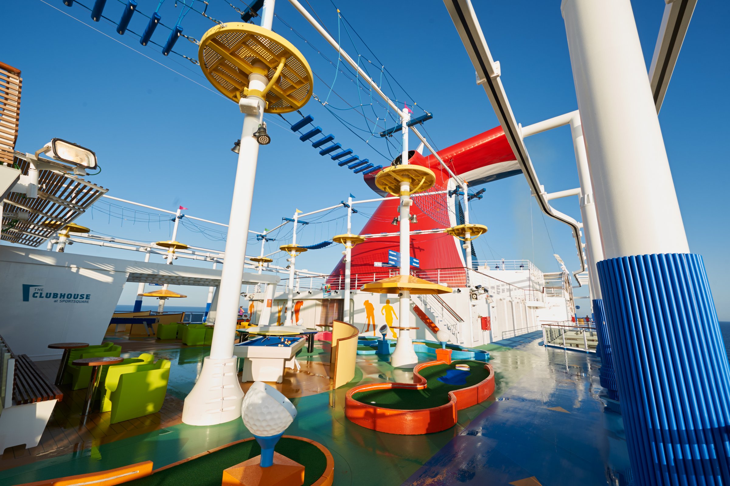 Carnival Vista SportSquare mini golf course with the SkyRide track and red funnel above