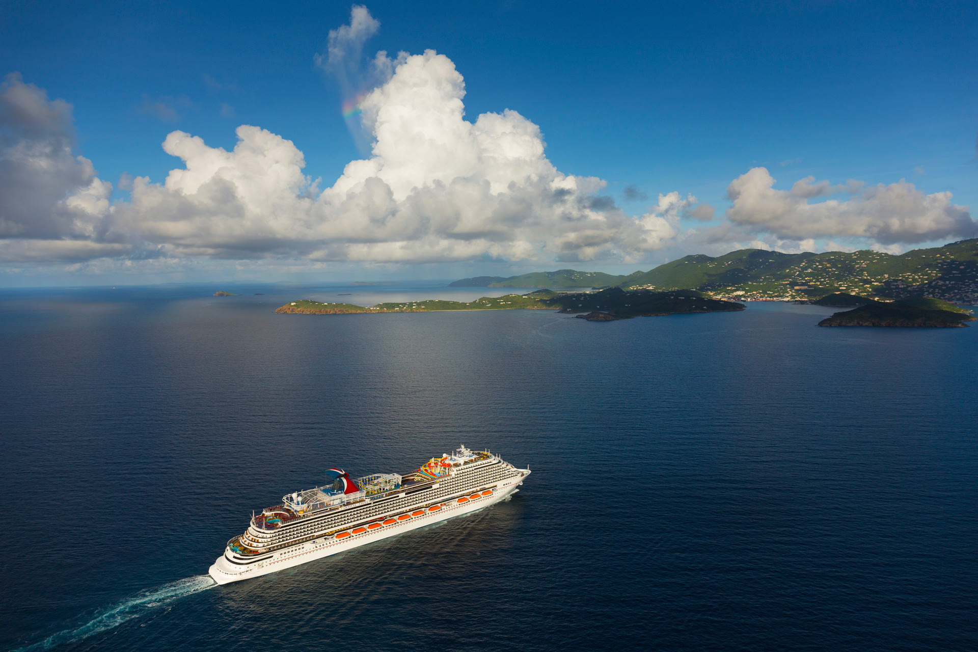 Carnival Vista sunny open-water aerial exterior with islands