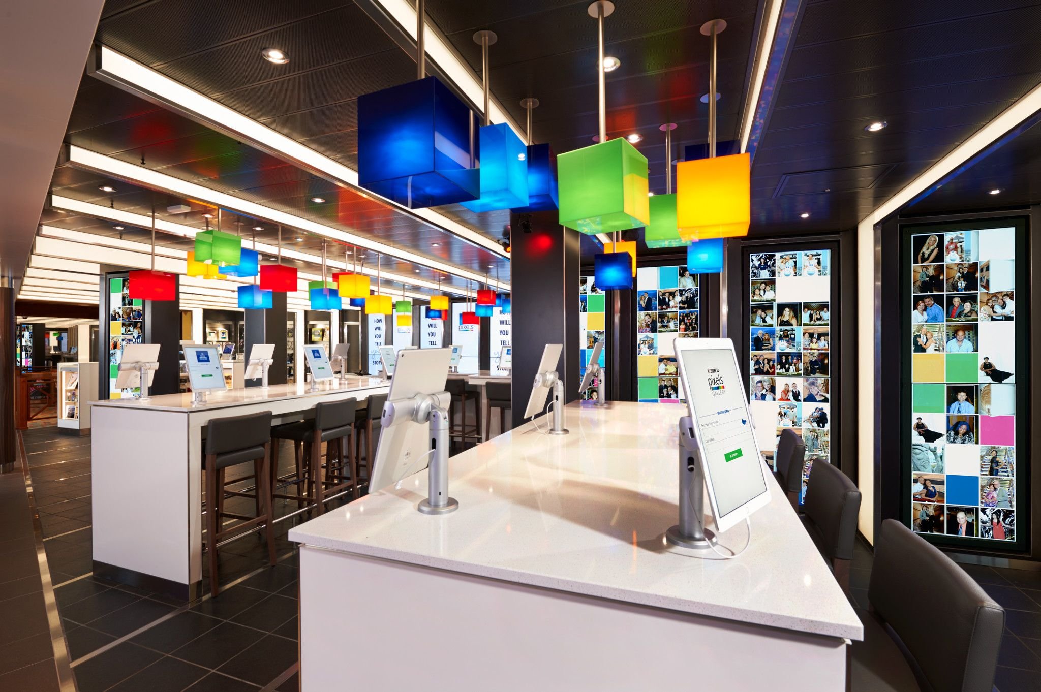 Carnival Vista Pixels photo gallery with touchscreen kiosks and colorful pendant lights