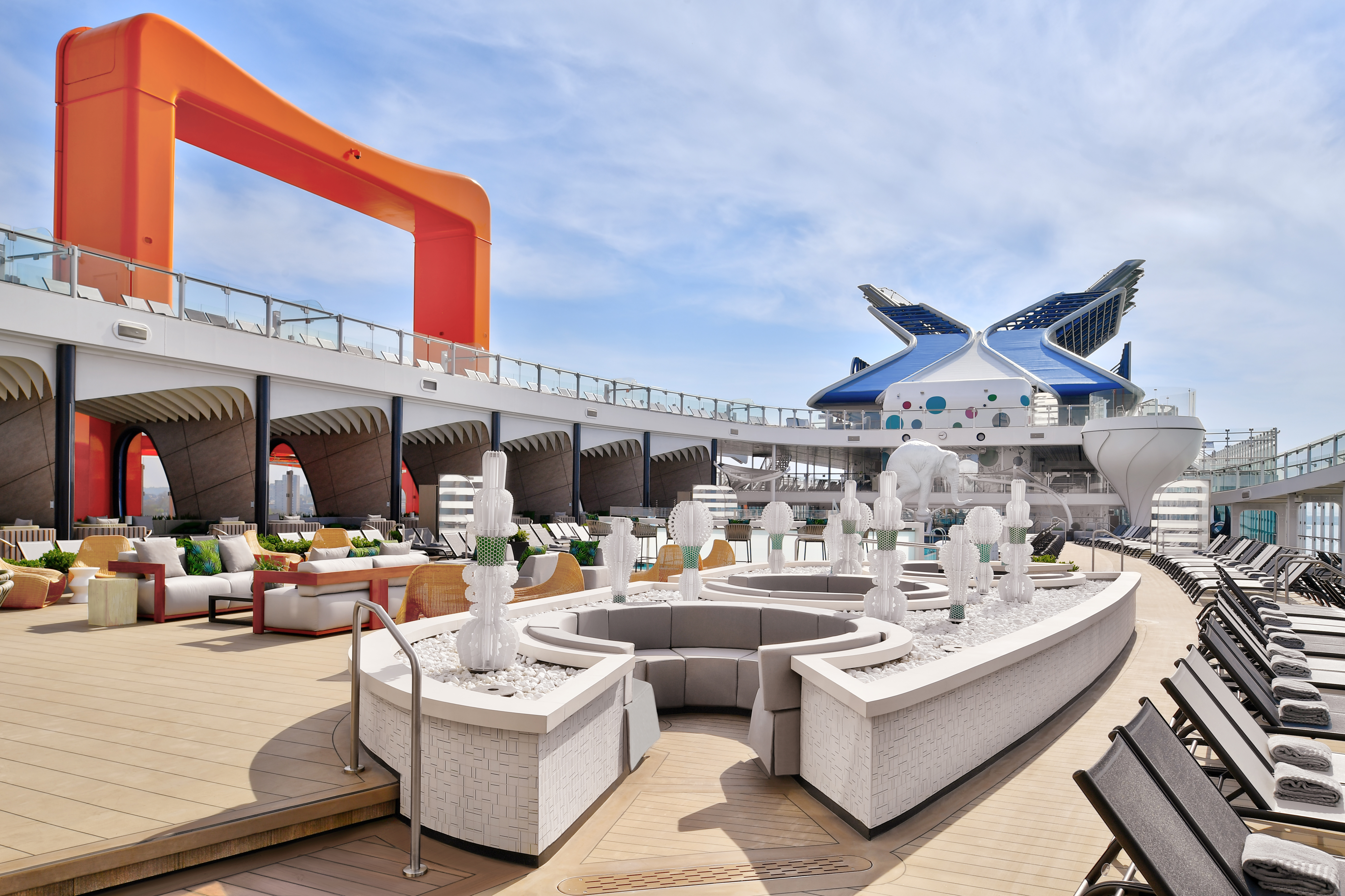 Celebrity Beyond Resort Deck with Lilipods and Magic Carpet under bright sun