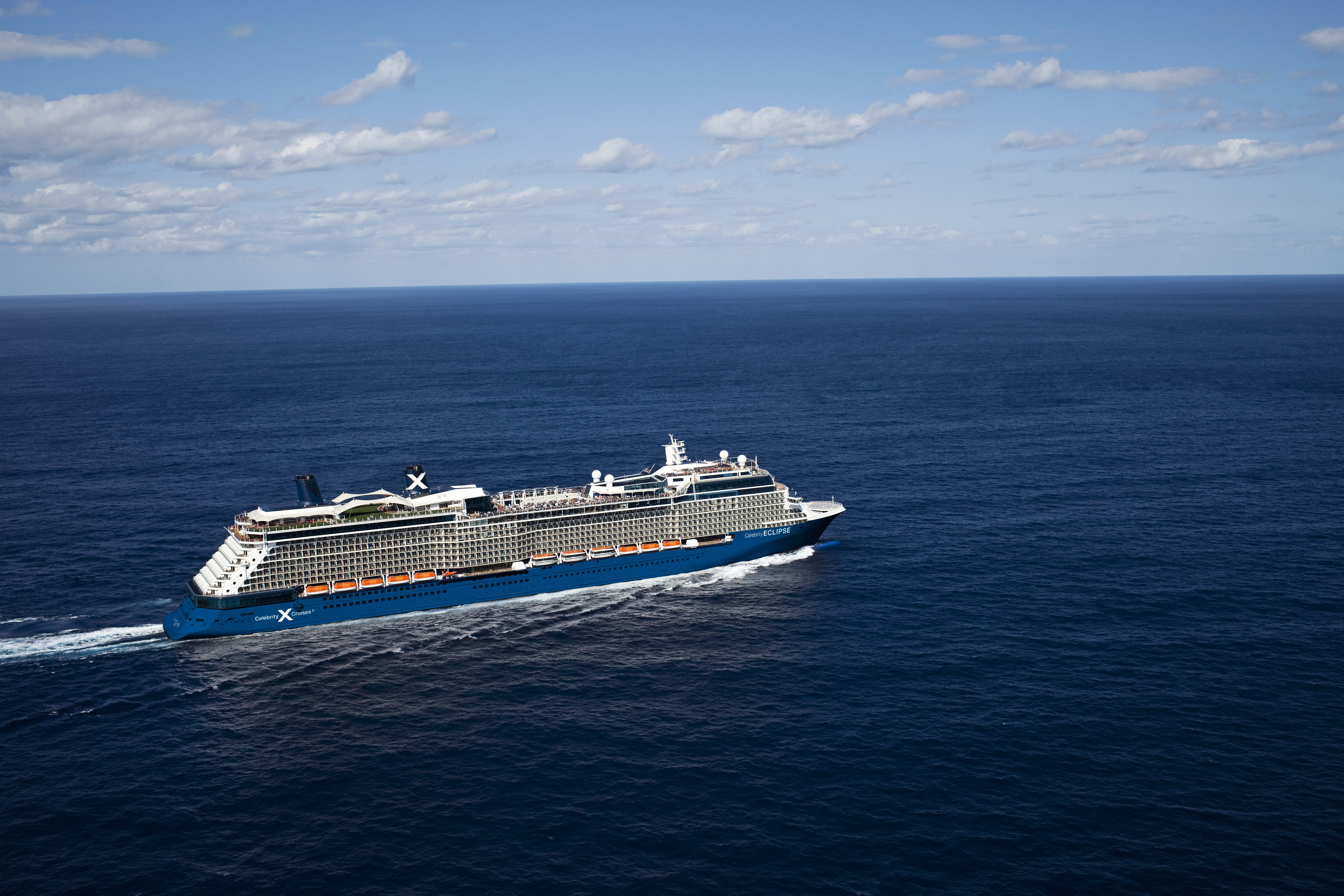 Celebrity Eclipse sunny aerial exterior underway with ECLIPSE on the hull
