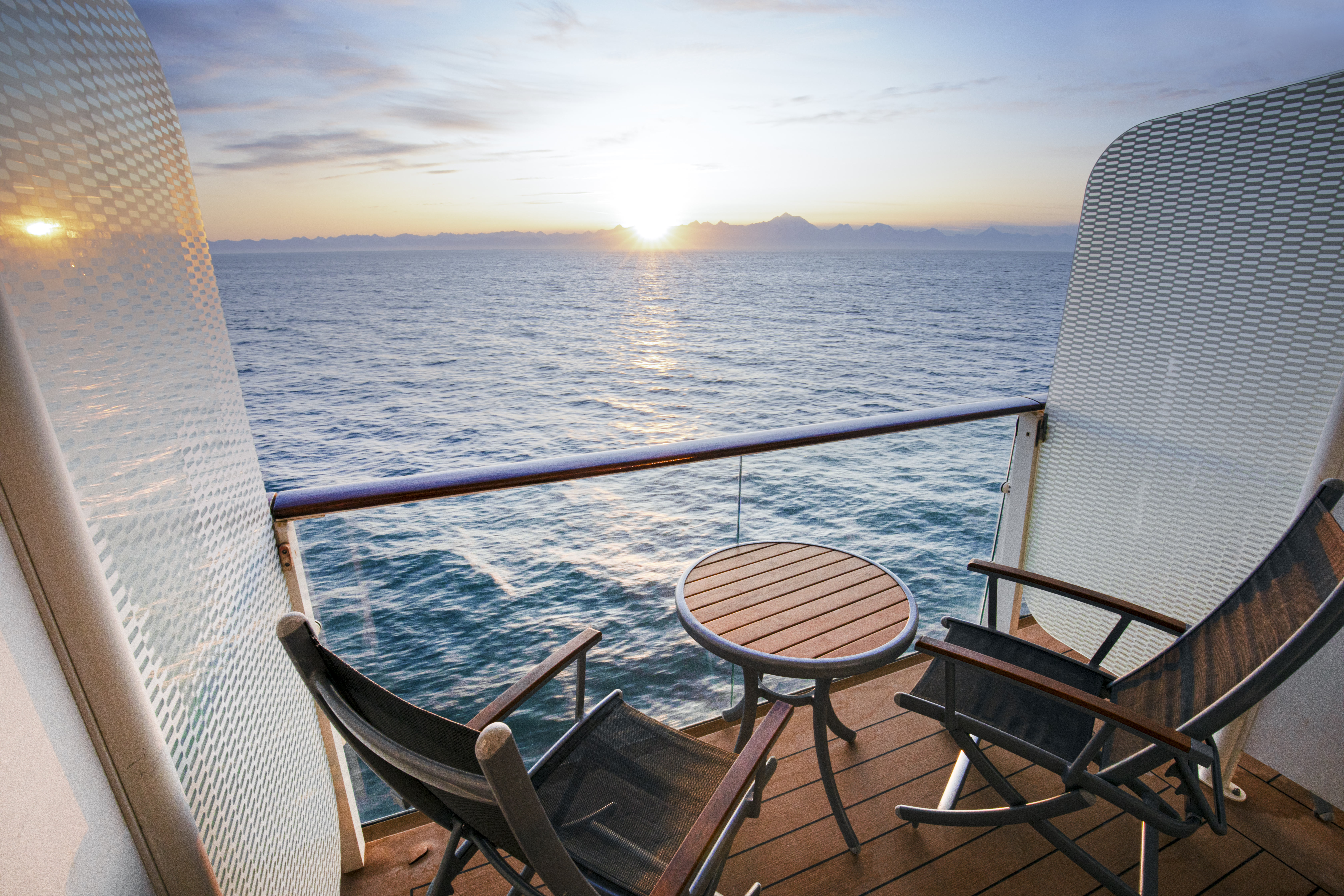 Celebrity Eclipse veranda balcony overlooking sunny ocean and mountains