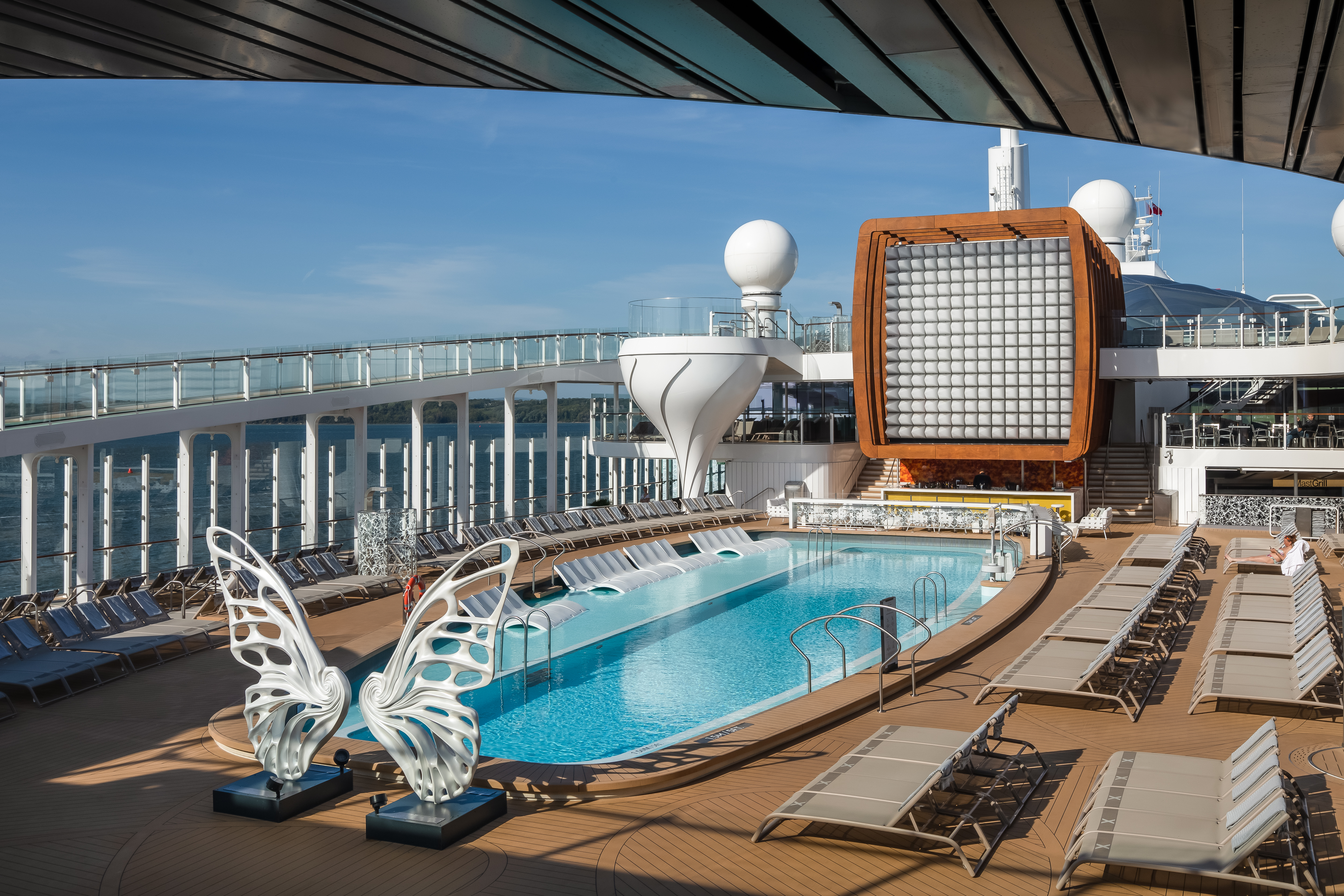 Celebrity Edge Resort Deck swimming pool under a clear blue sky