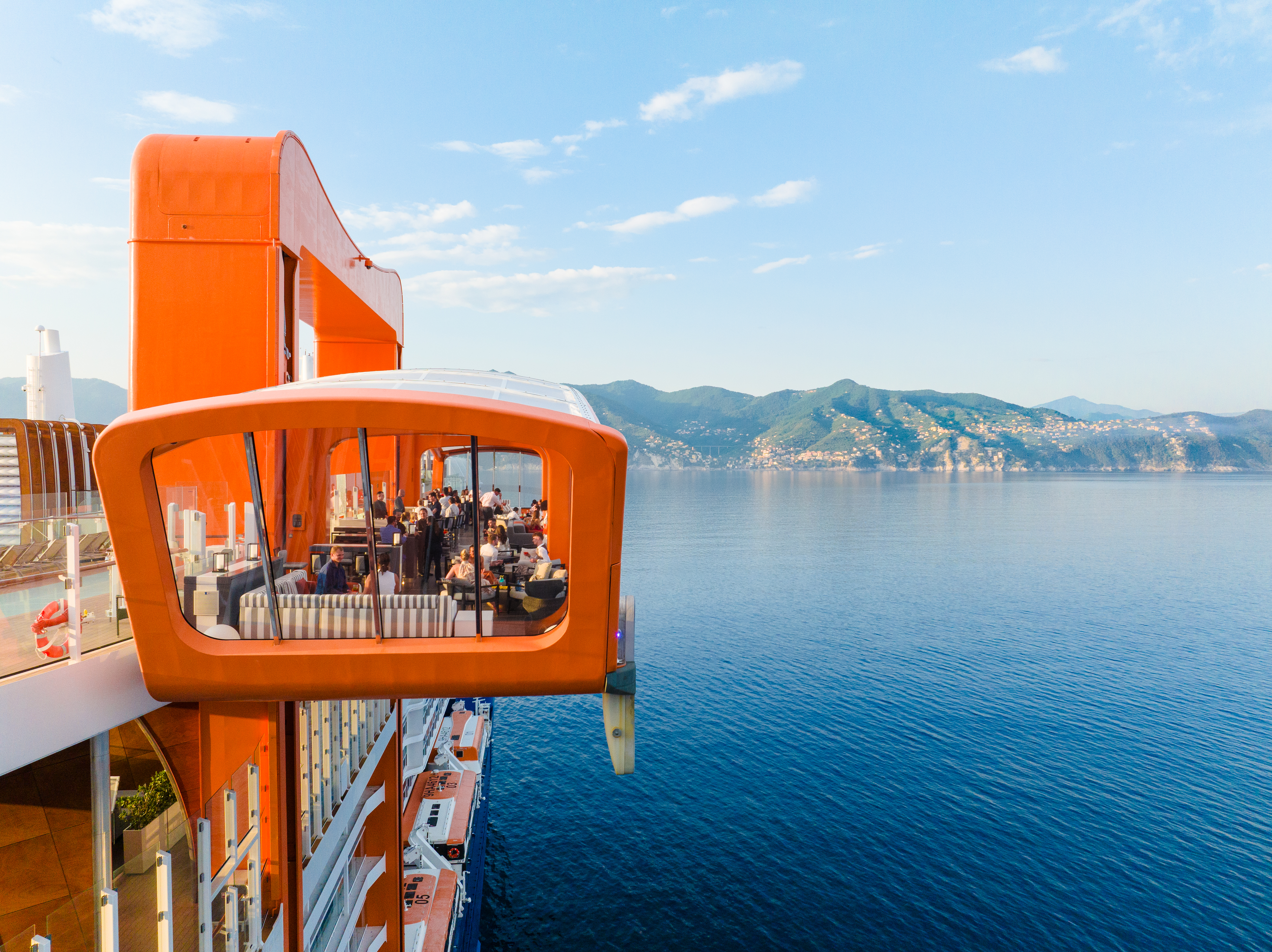 Celebrity Edge Magic Carpet overlooking sunny Portofino coastline