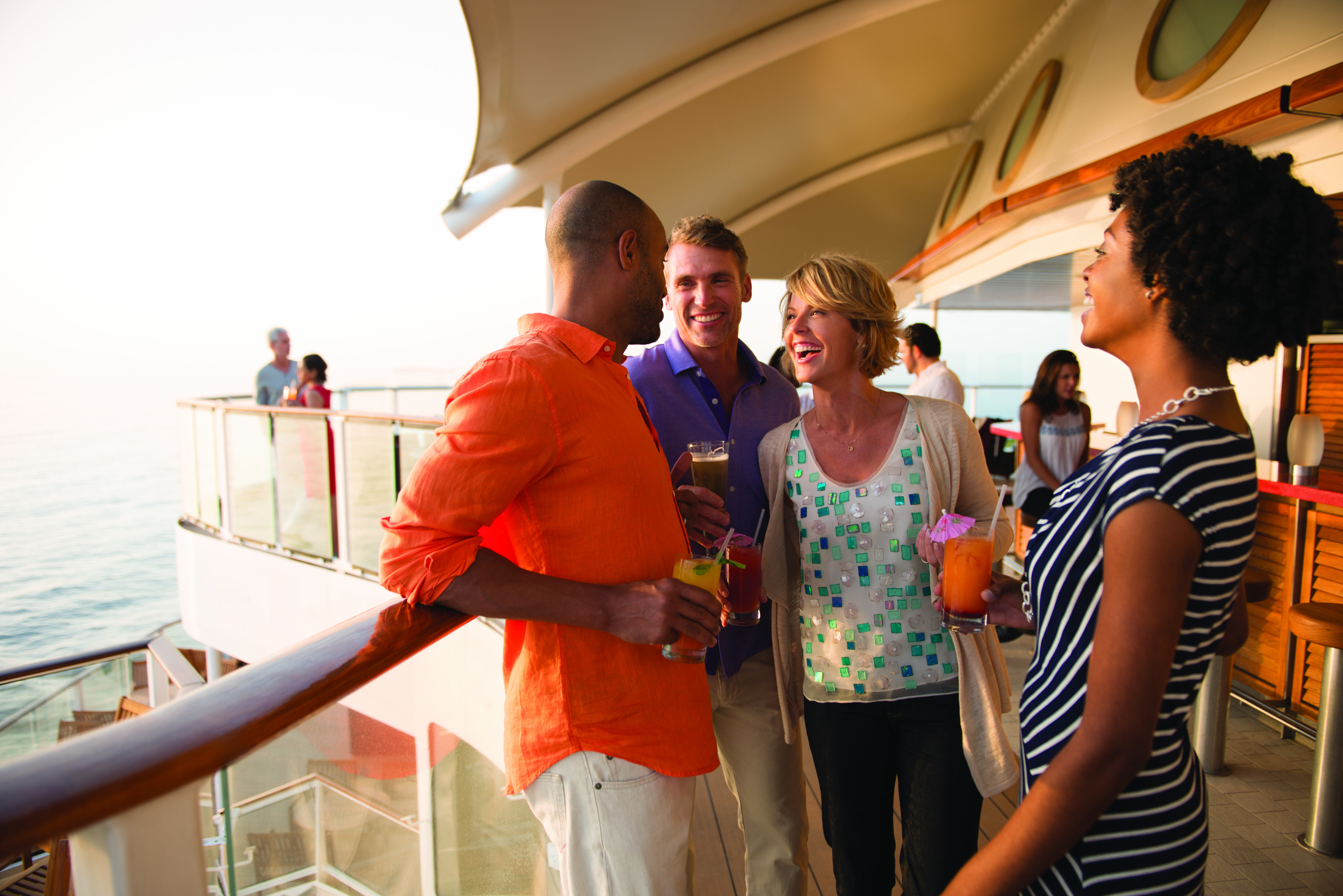 Celebrity Equinox Sunset Bar guests with cocktails in warm daylight