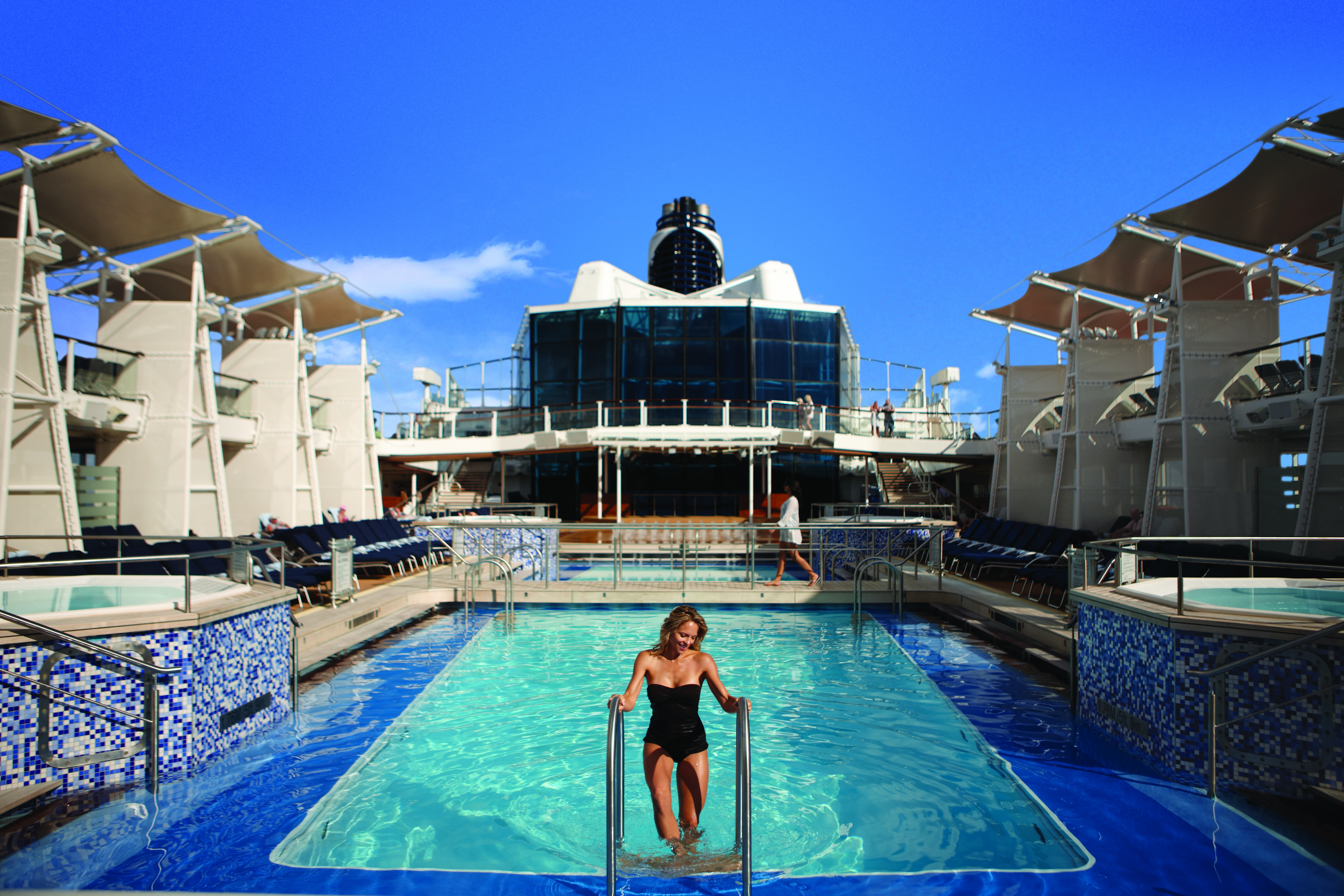 Celebrity Equinox main pool deck under a clear blue sky