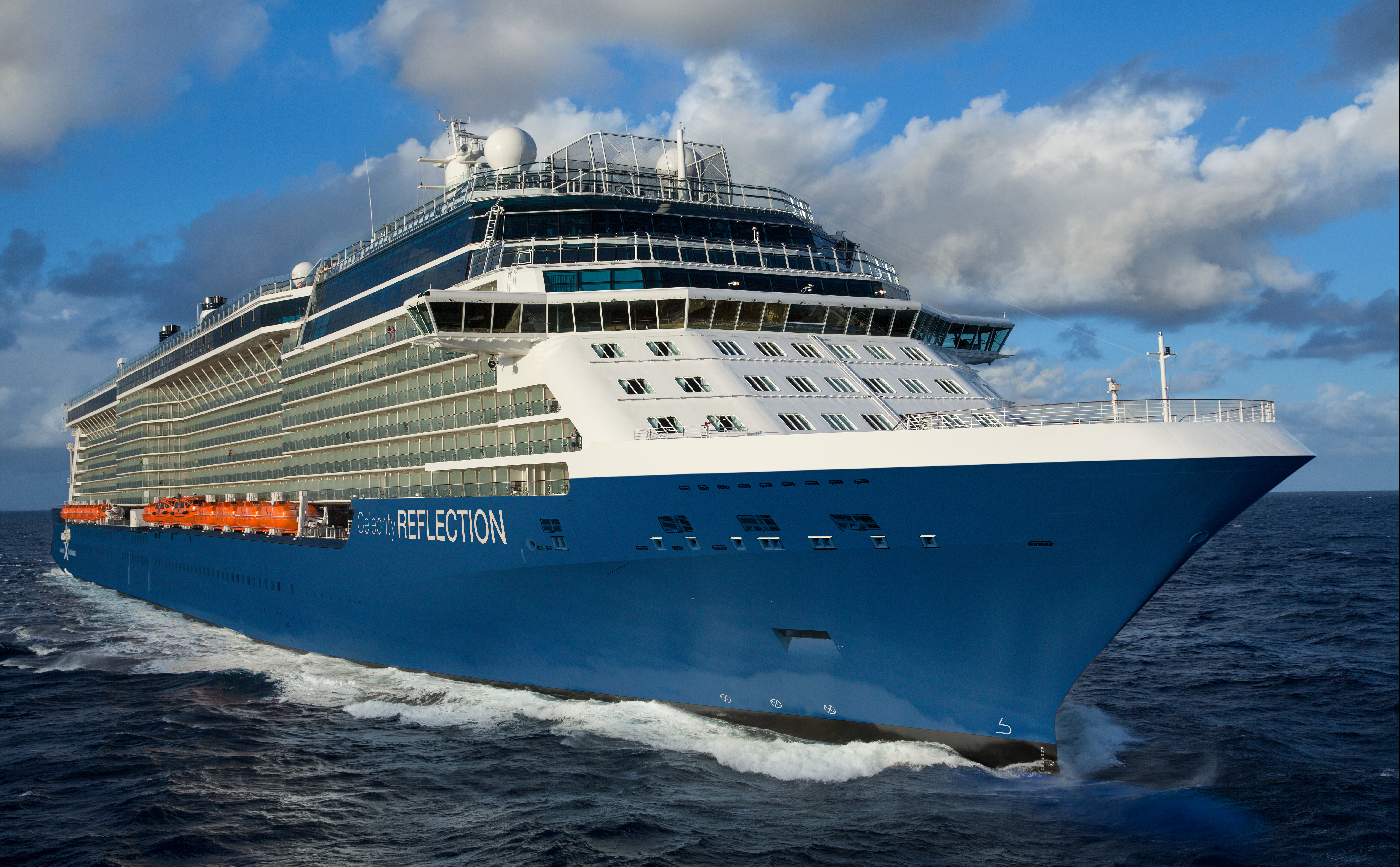Celebrity Reflection sunny bow exterior underway with REFLECTION on the hull