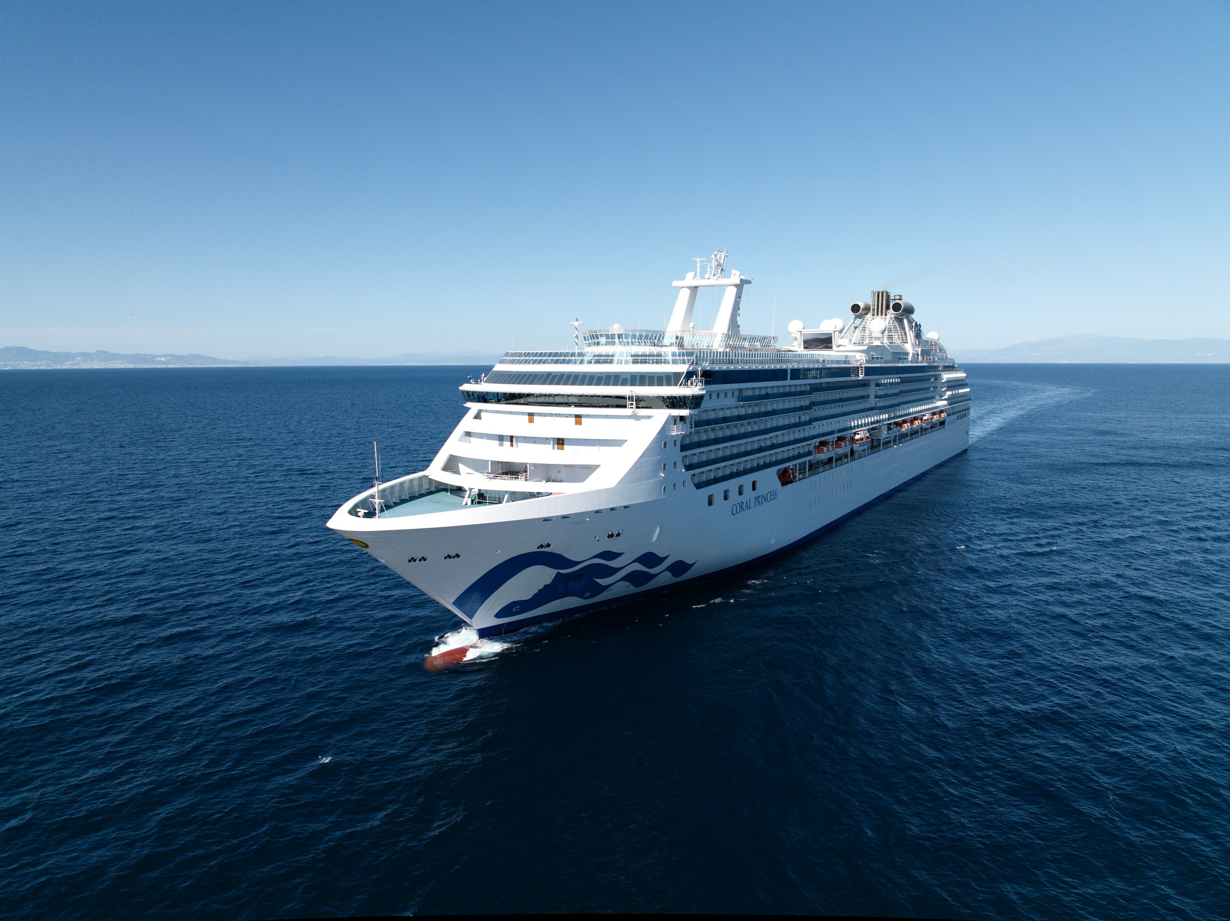 Coral Princess bow aerial underway in blue water