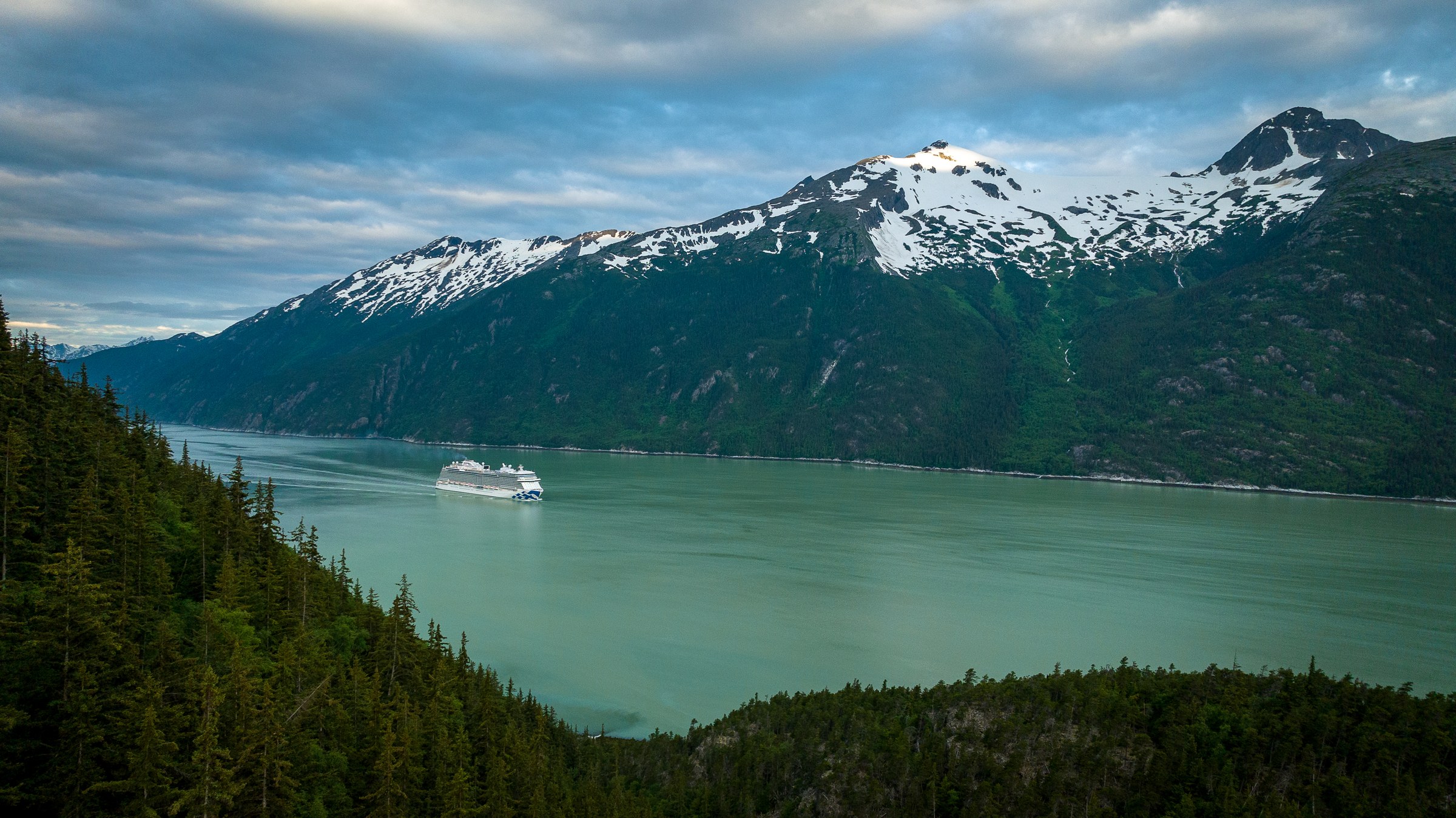 Discovery Princess aerial in Skagway, Alaska, against green mountains