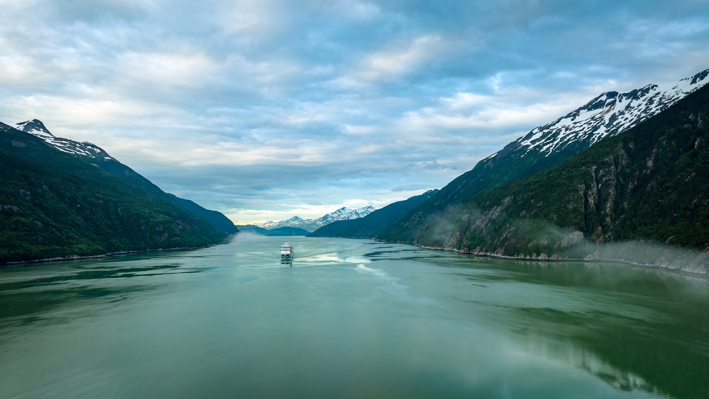 Discovery Princess aerial in Skagway, Alaska, against green mountains