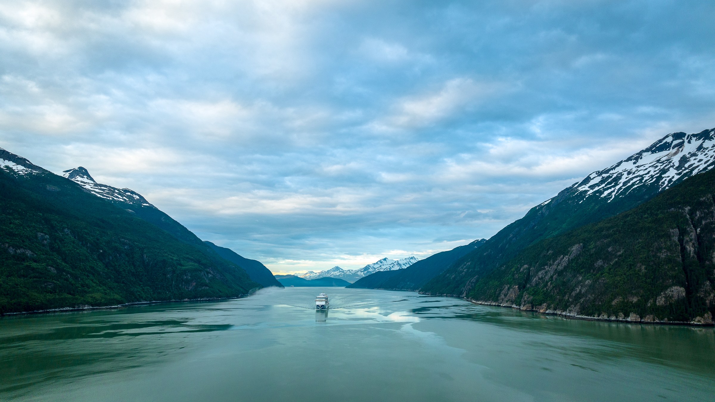 Discovery Princess aerial in Skagway, Alaska, against green mountains