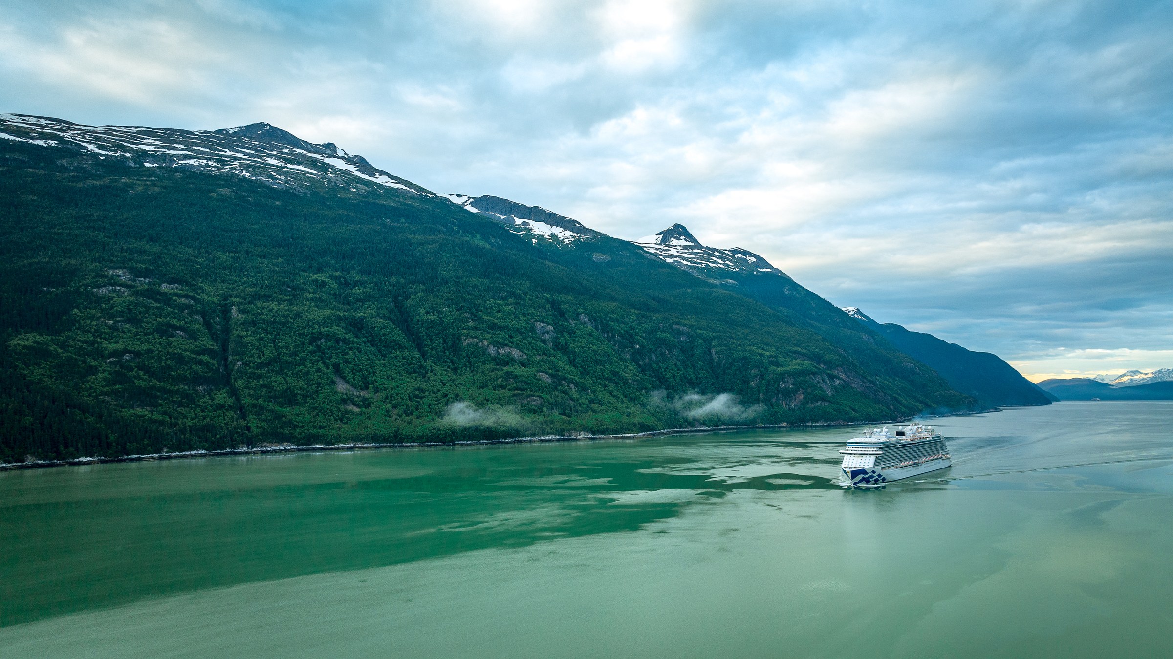 Discovery Princess aerial in Skagway, Alaska, against green mountains