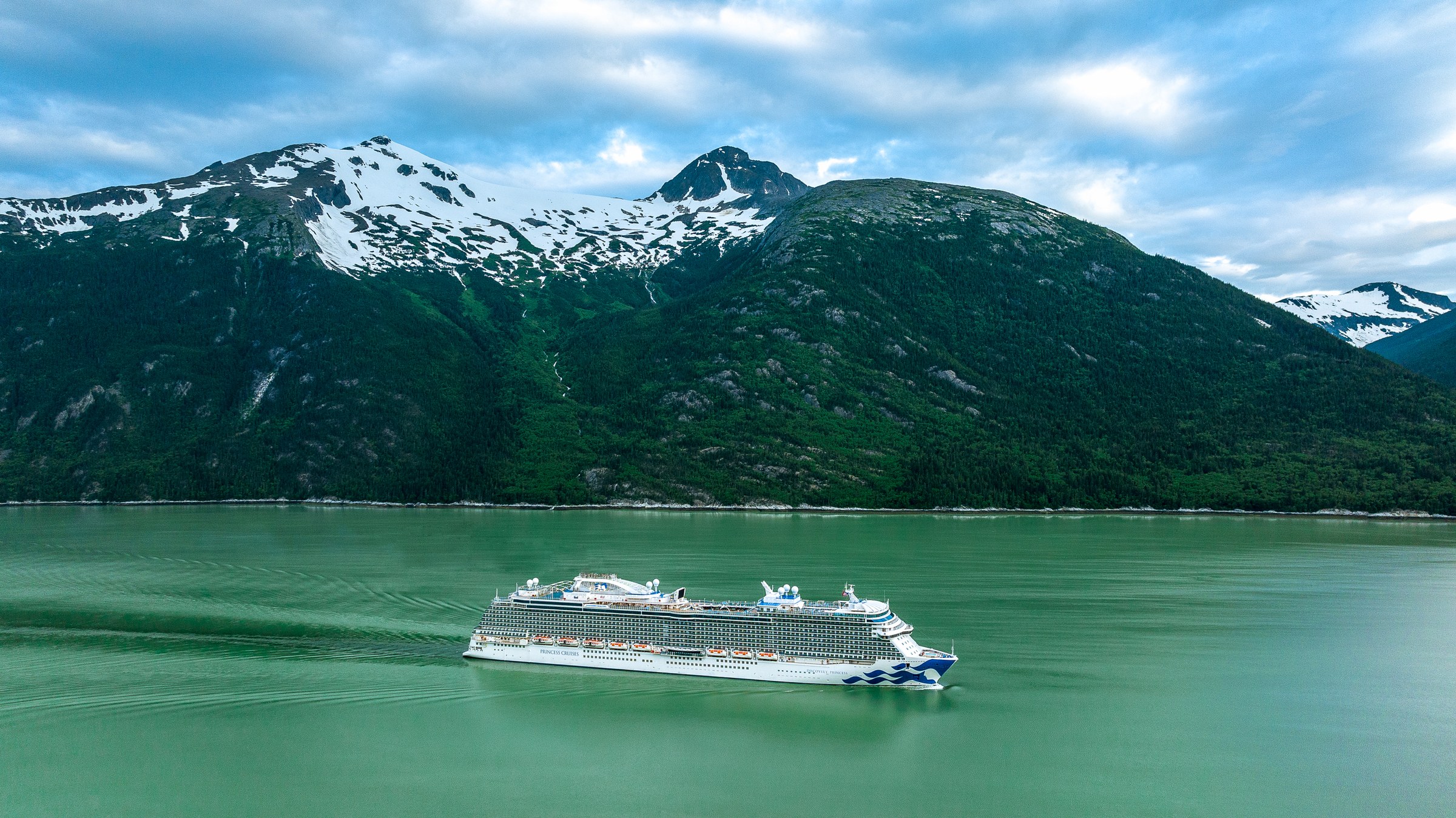 Discovery Princess aerial in Skagway, Alaska, against green mountains