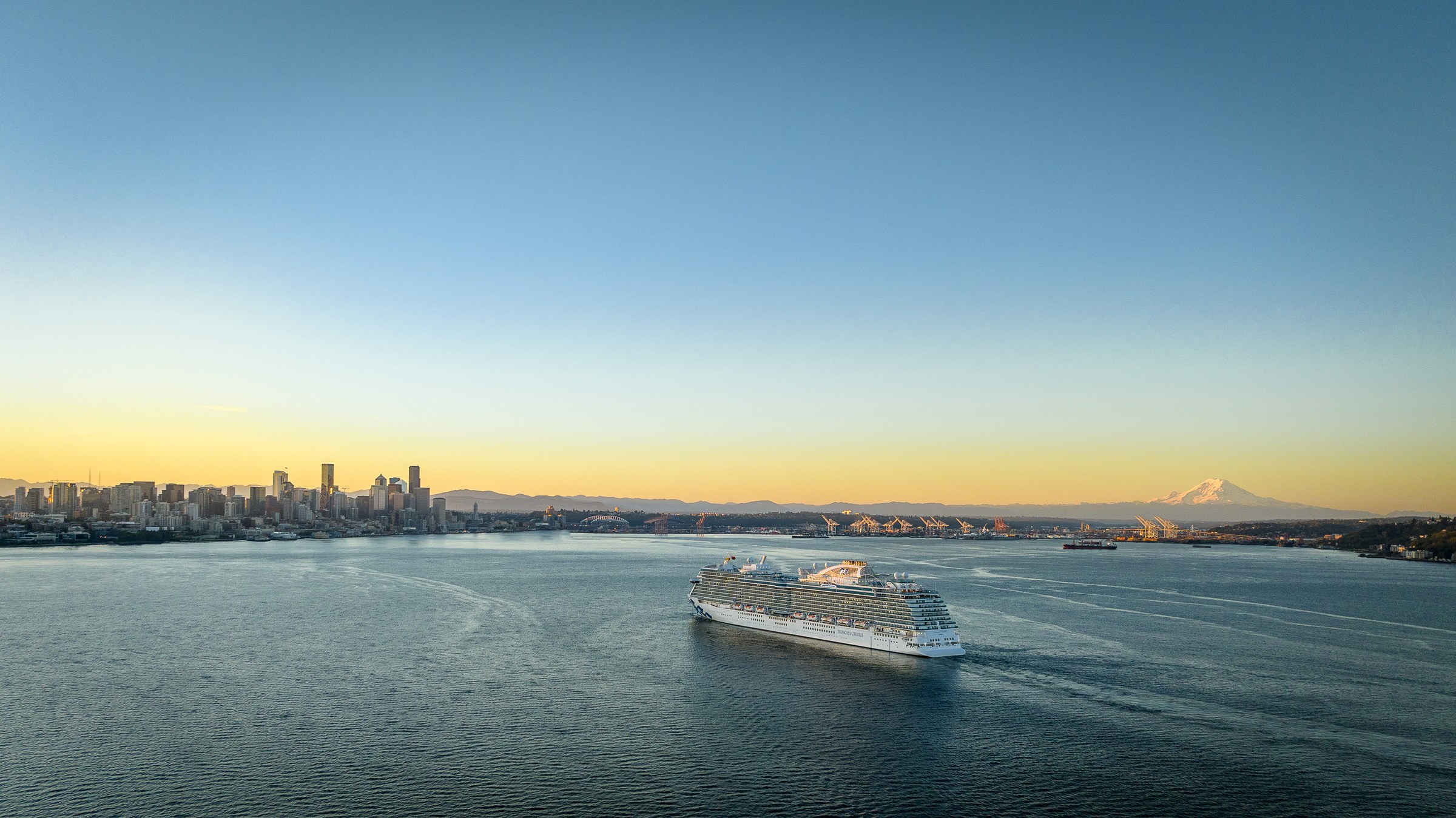 Discovery Princess sailing Elliott Bay near Seattle at golden hour